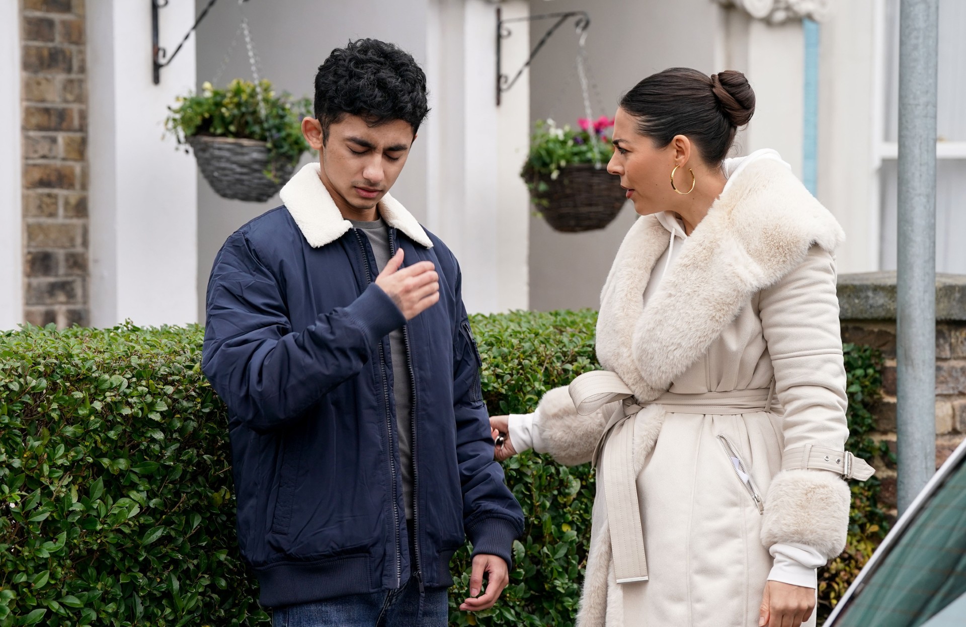 Priya looks worried as she talks to Nugget on EastEnders
