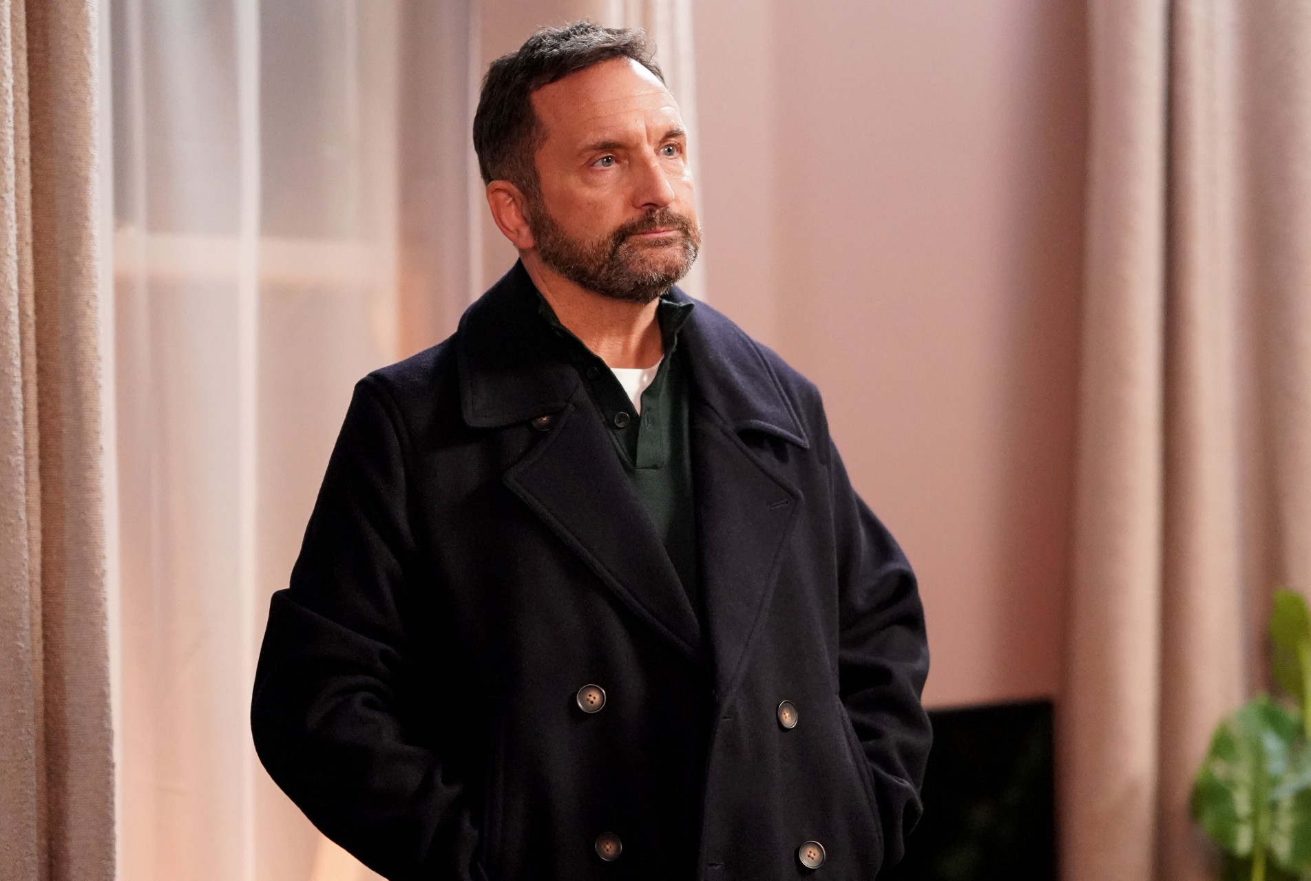 Jake standing in the Vic upstairs living room