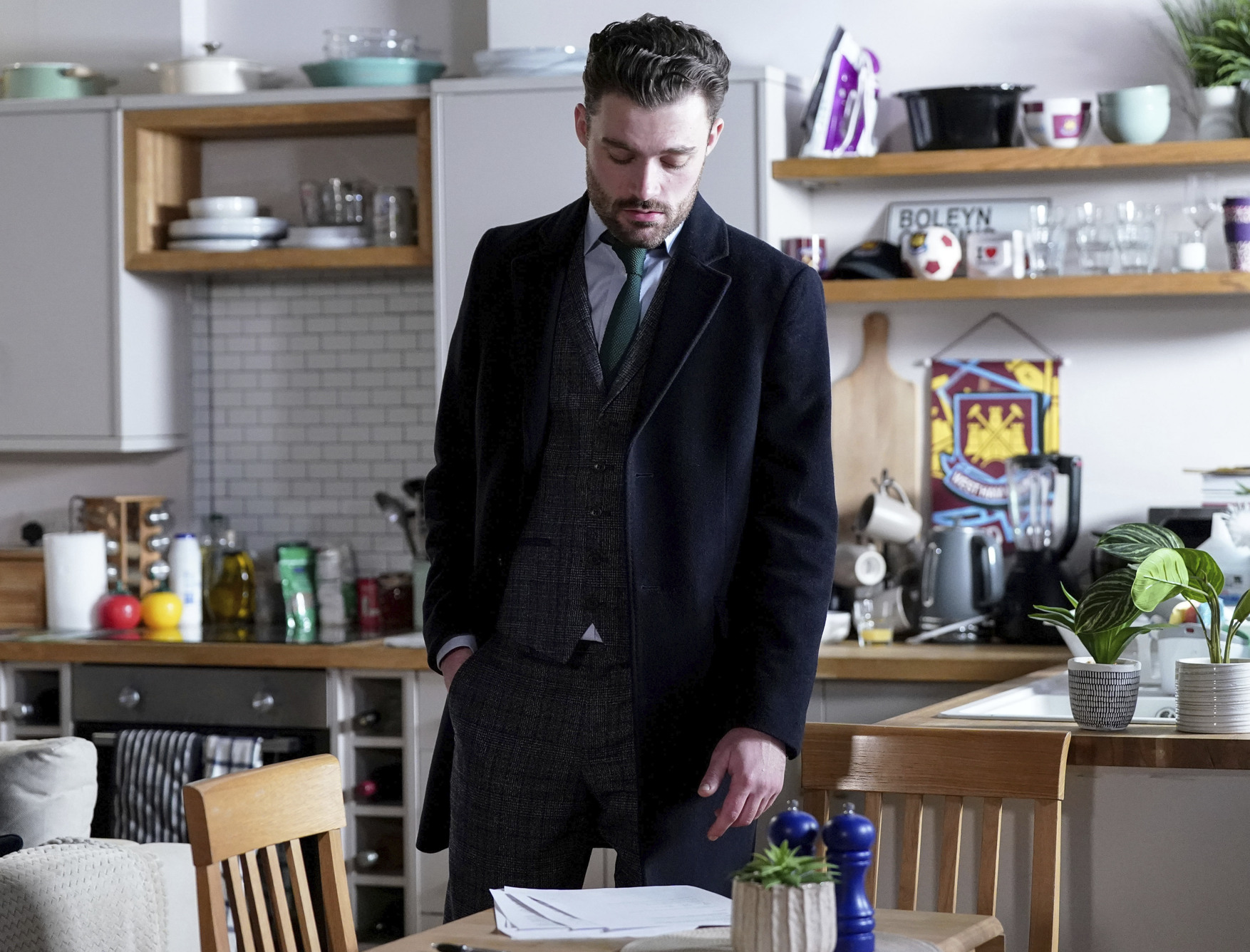 Johnny looking at papers looking worried