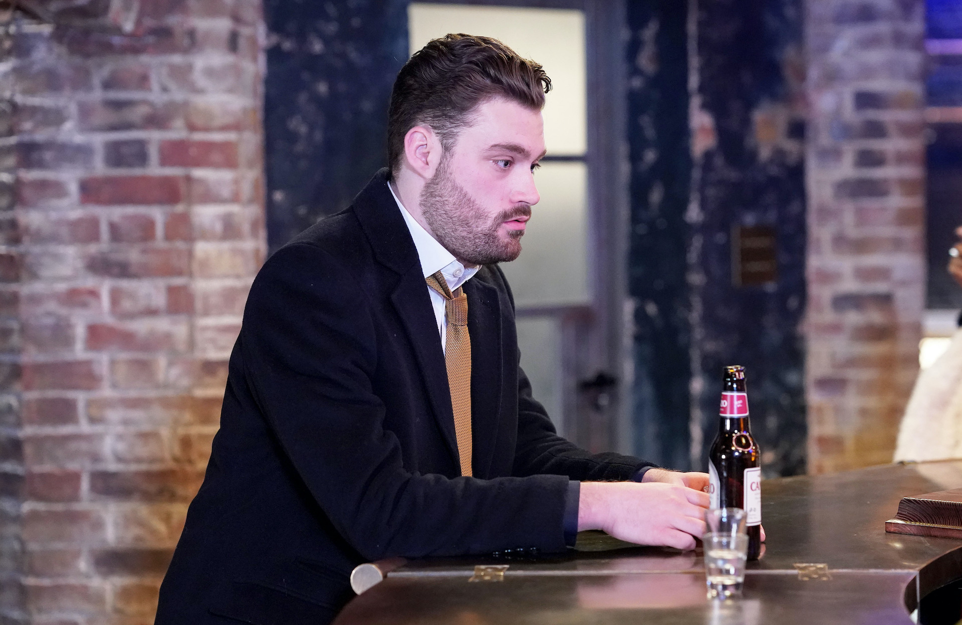 Johnny looking worried as he has a beer in EastEnders spoilers 