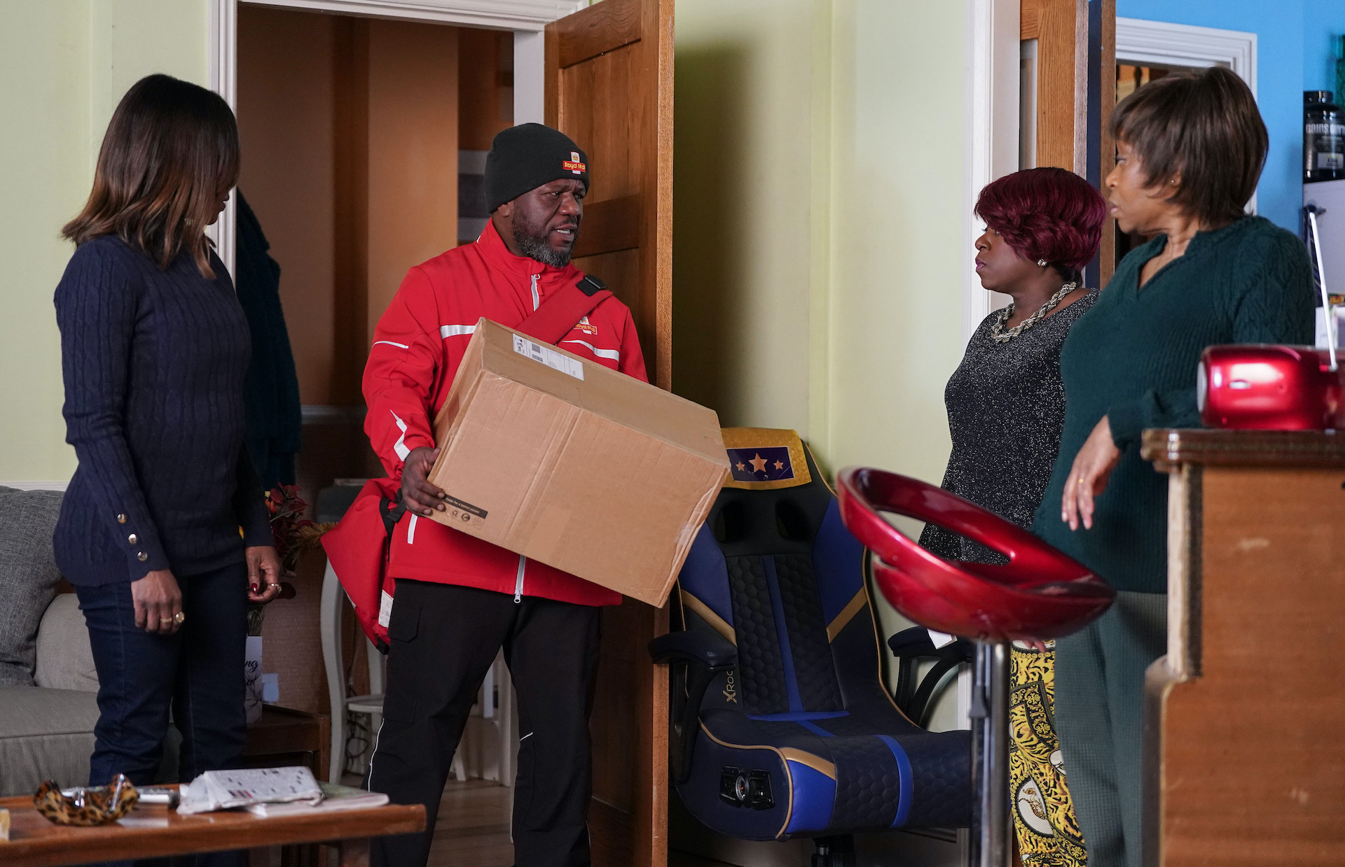 Yolande and Kim welcome Howie who is delivering a parcel