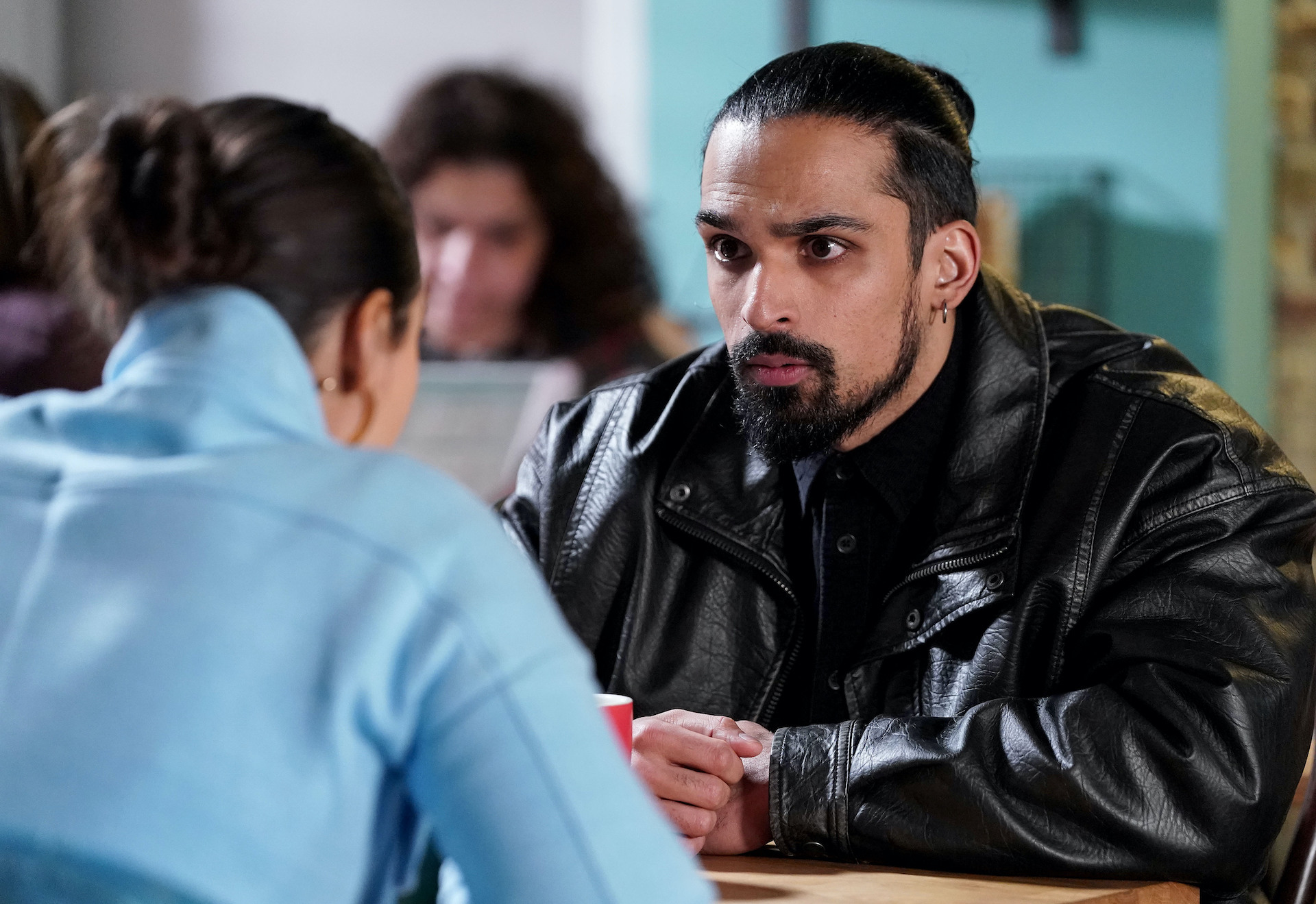 Ravi and Priya talking in the cafe 