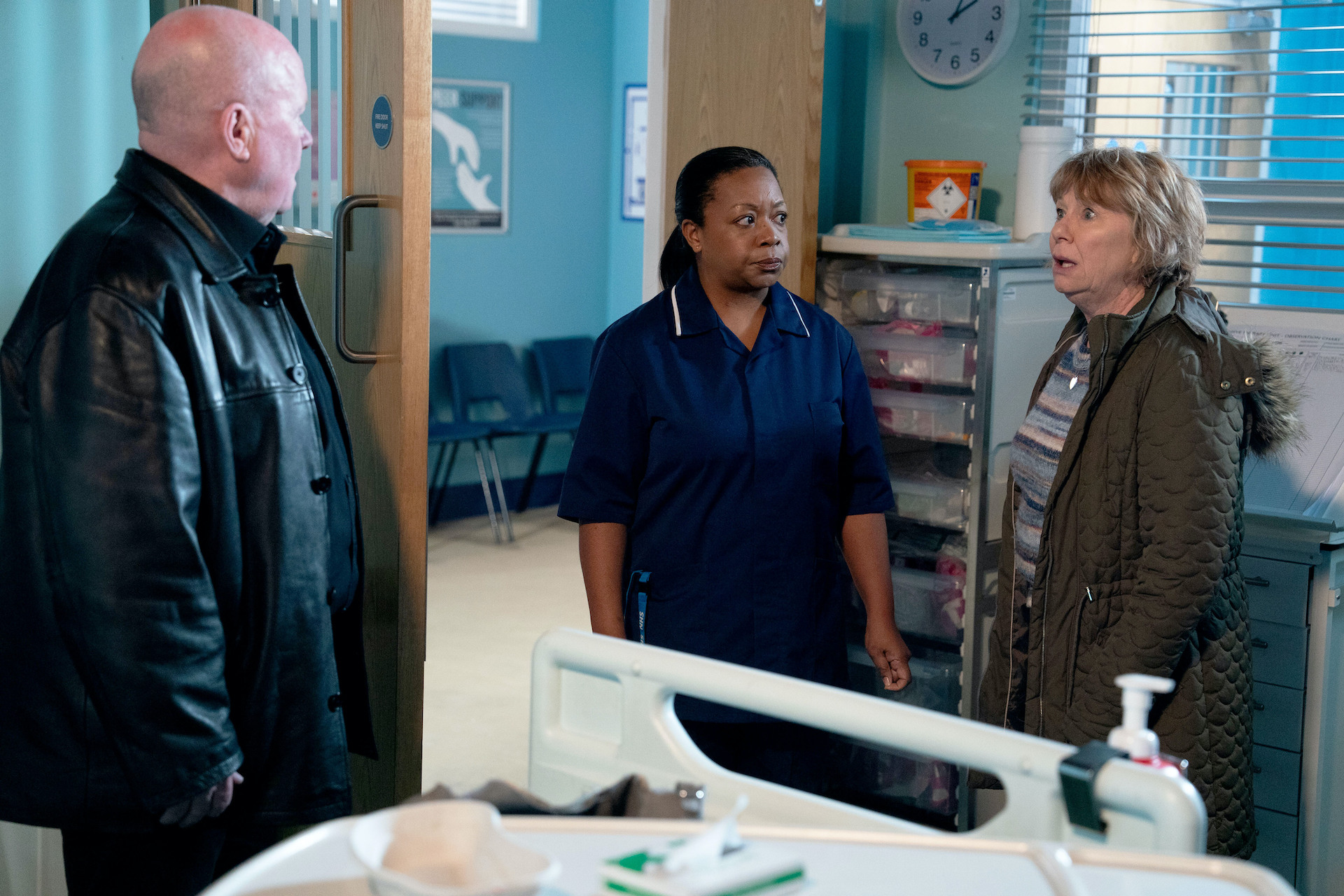 Julie and Phil looking shocked as they talk to a nurse 