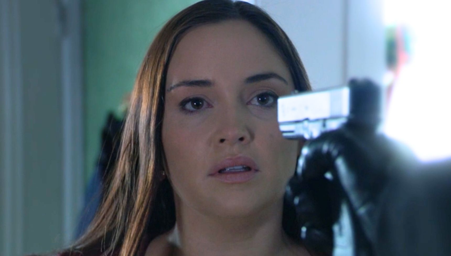 Lauren with a gun pointing at her in the EastEnders flashforward