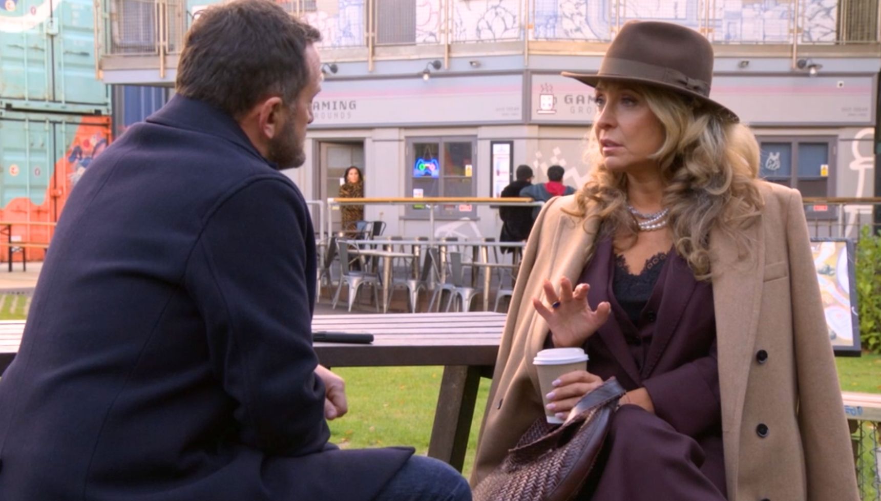 Chrissie and Jake talk in the park