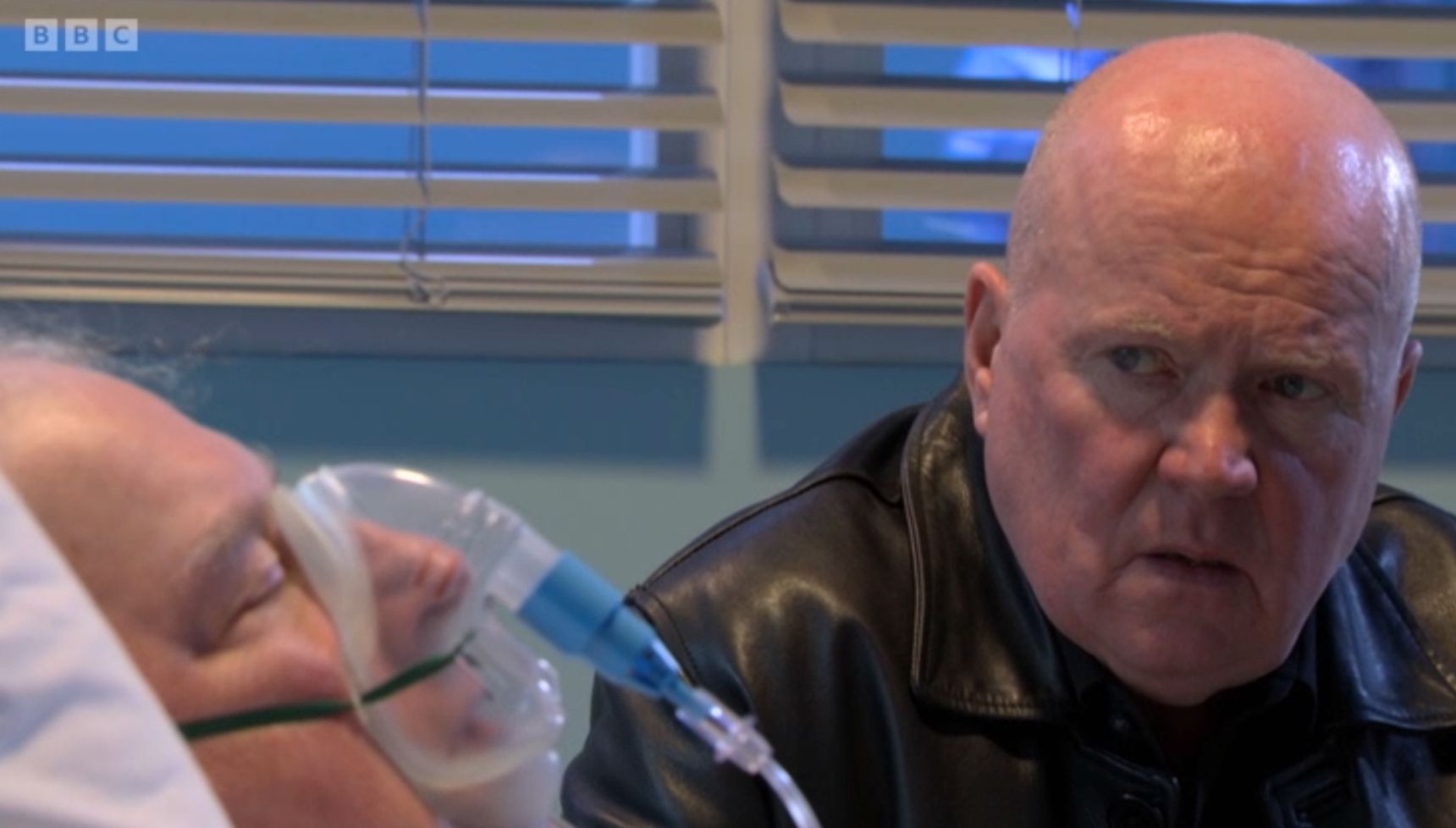 Phil watches over Nigel who is in his hospital bed 