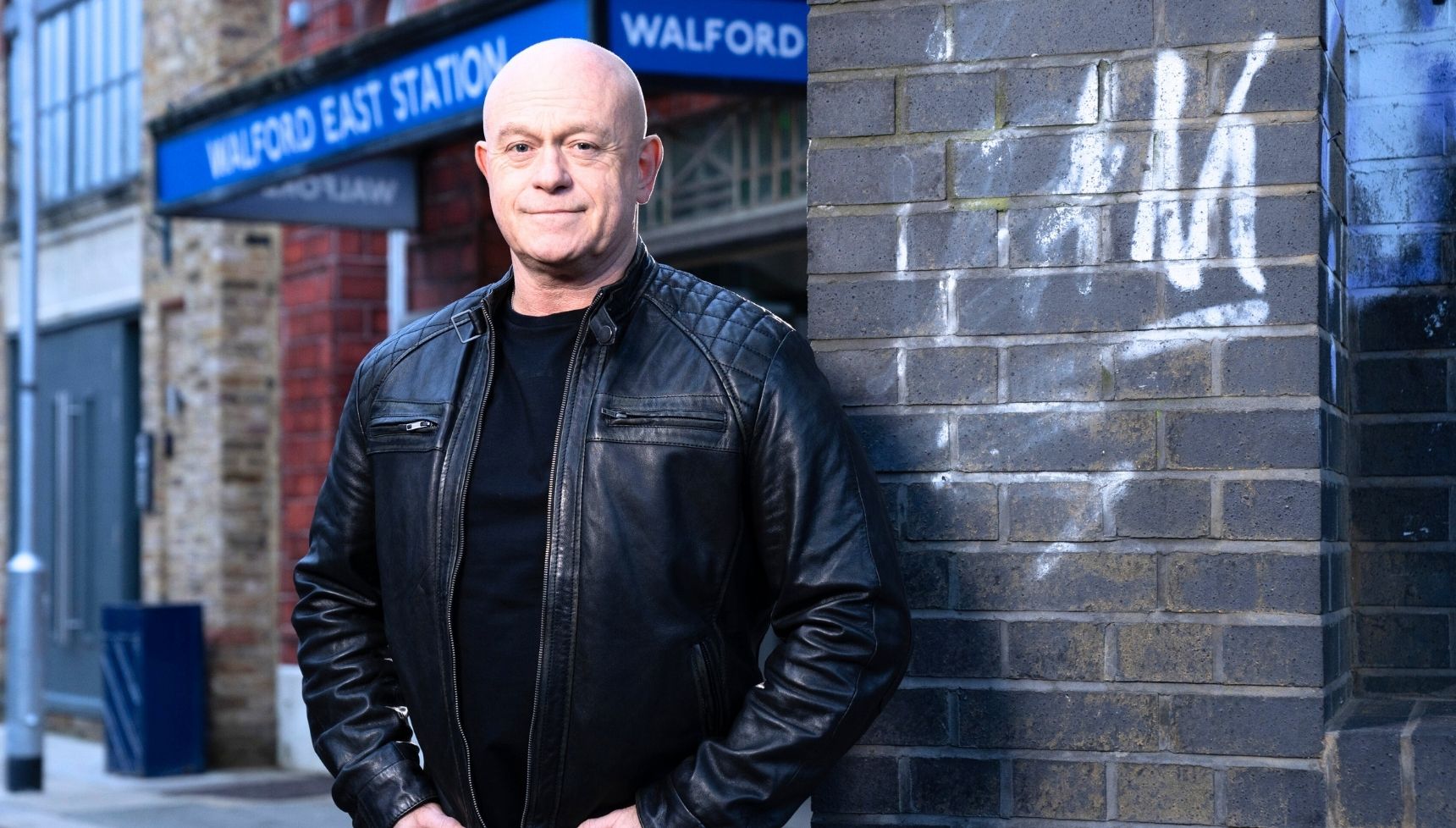 Grant Mitchell standing by the tube station for press shot