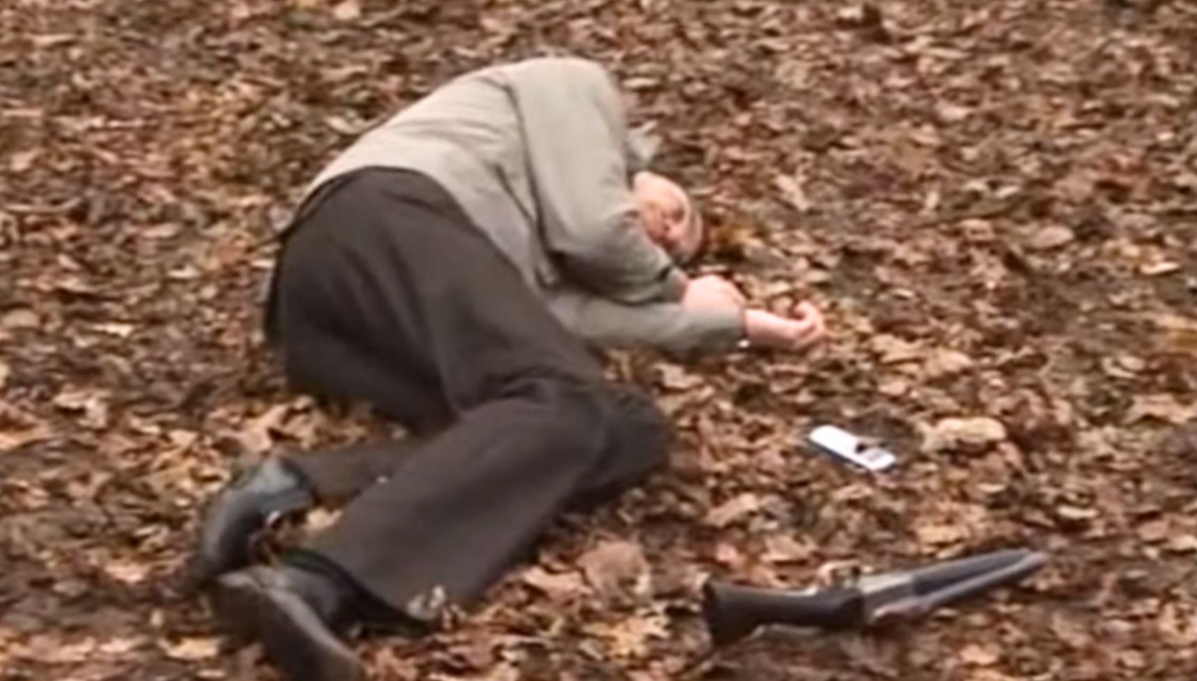 Danny lies dead on the floor of a forest