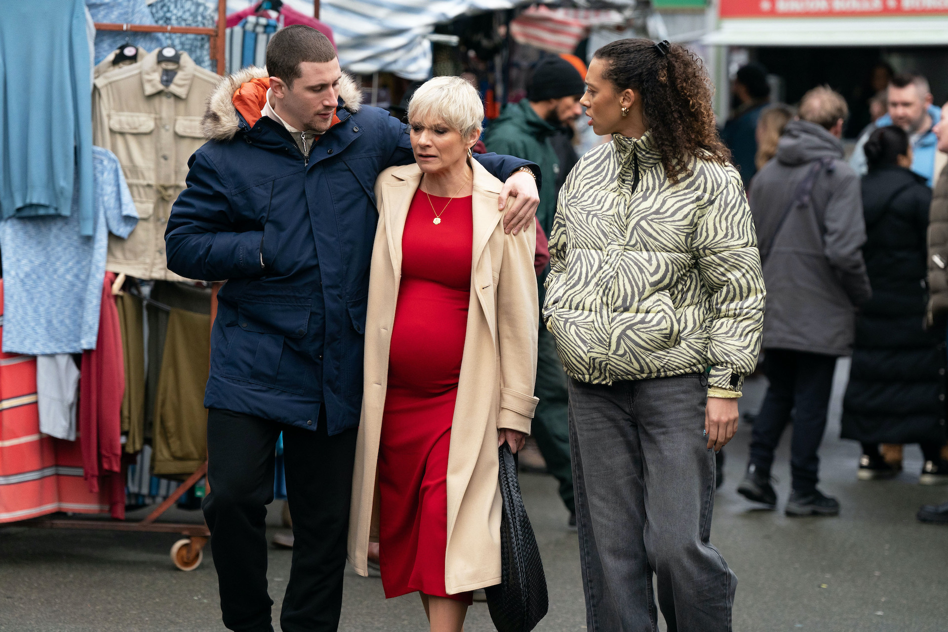 Gina and Harry walk through the market with Nicola, who looks worried 