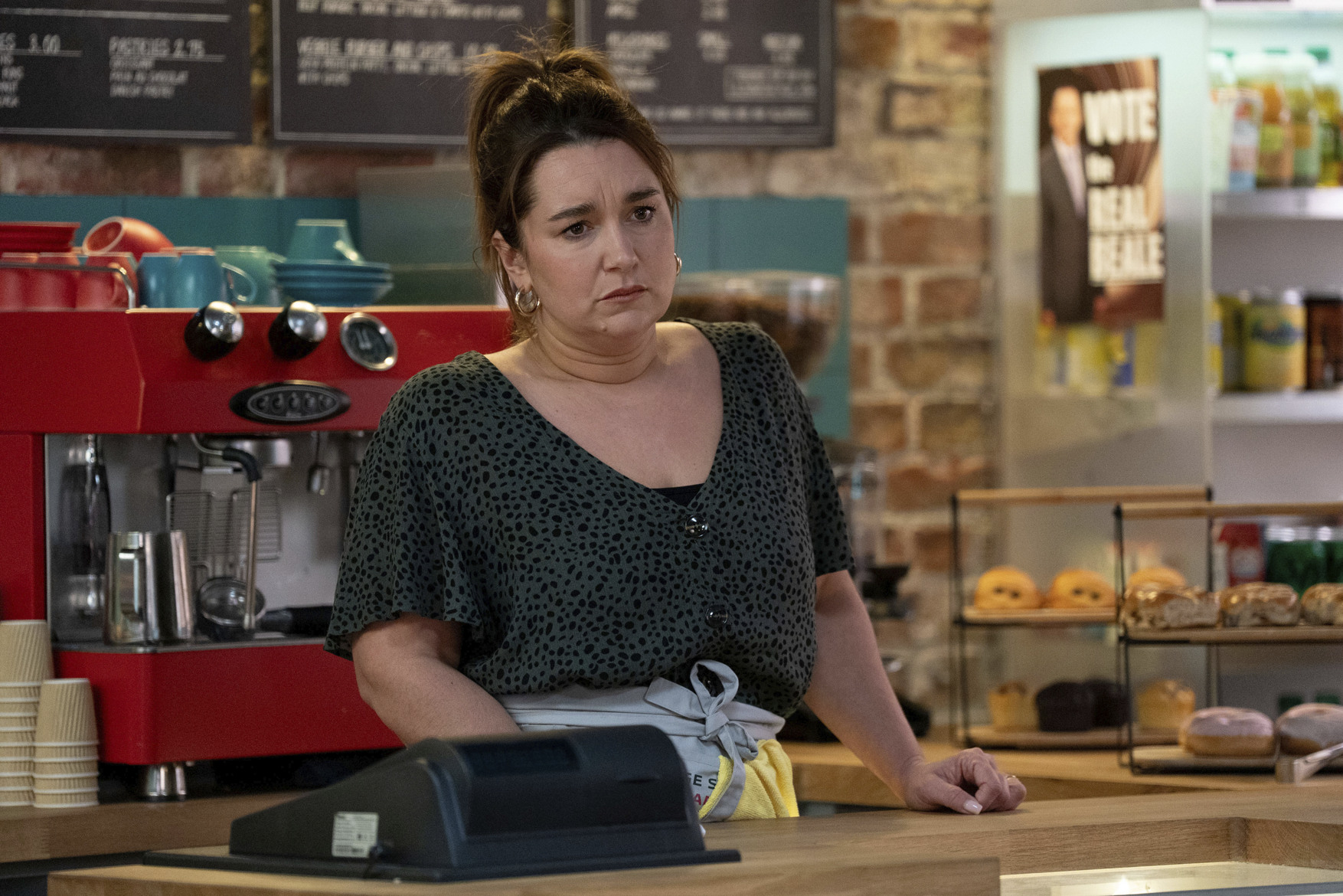 Vicki looking upset in the cafe