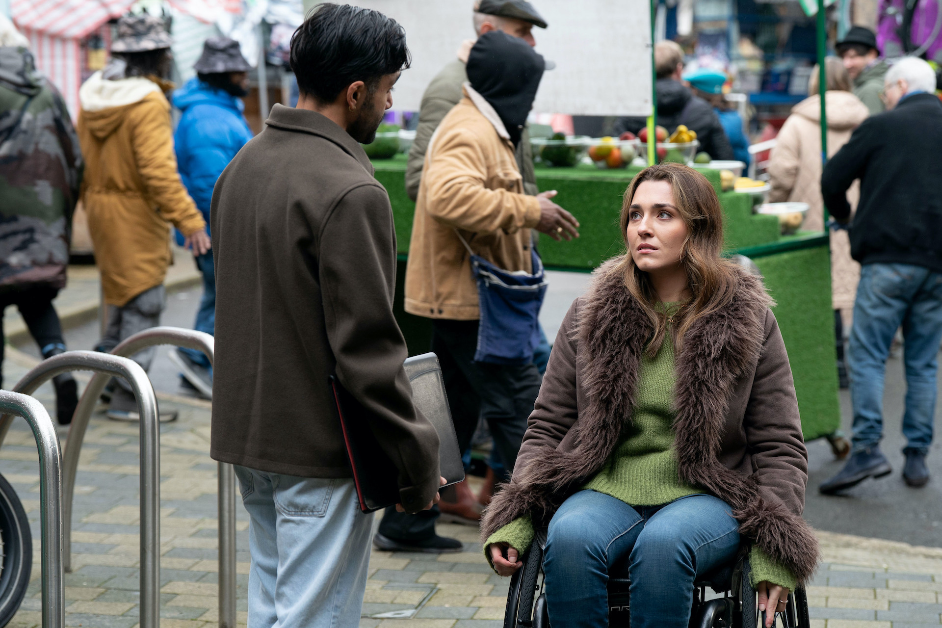 Penny and Vinny talking in the market 