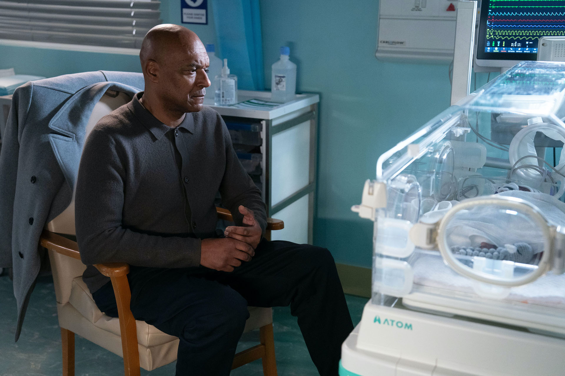George watching Ivy who is in an incubator 