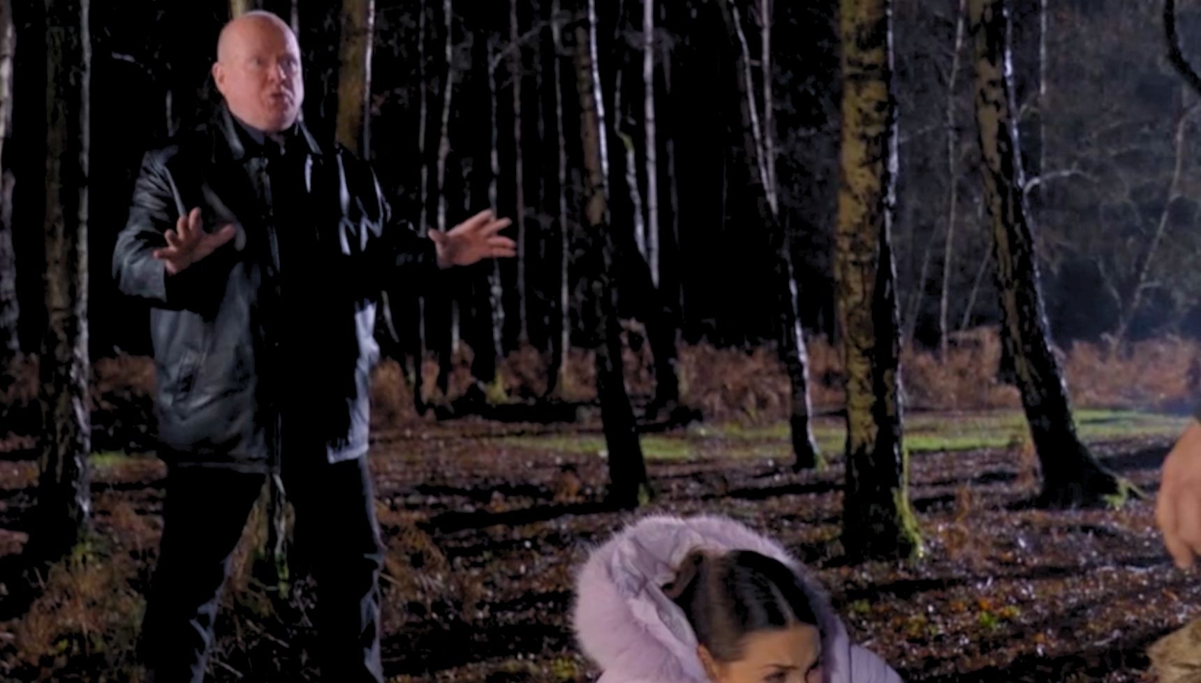 Phil arrives to stop the showdown in the woods