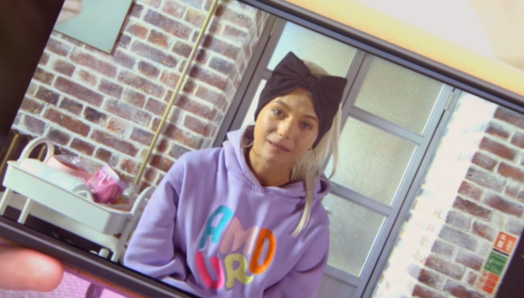 Lola is seen on a video on Lexi's phone in EastEnders 