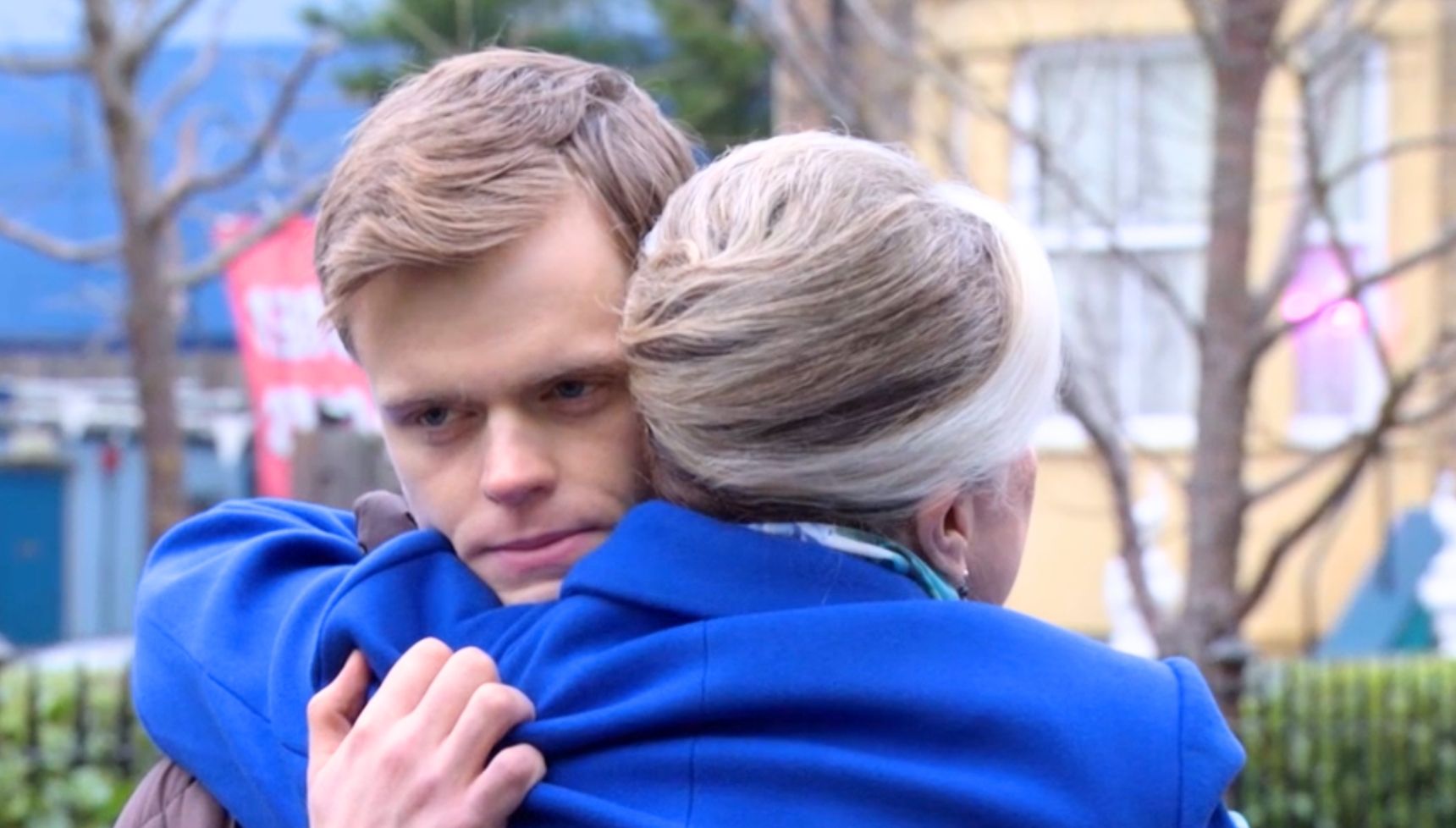 Oscar hugging his gran in the street 