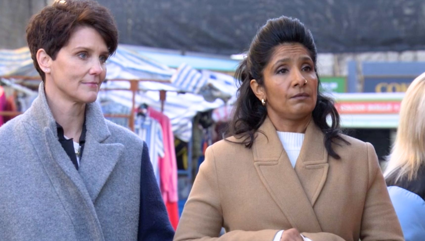 Eve and Suki talking in the market
