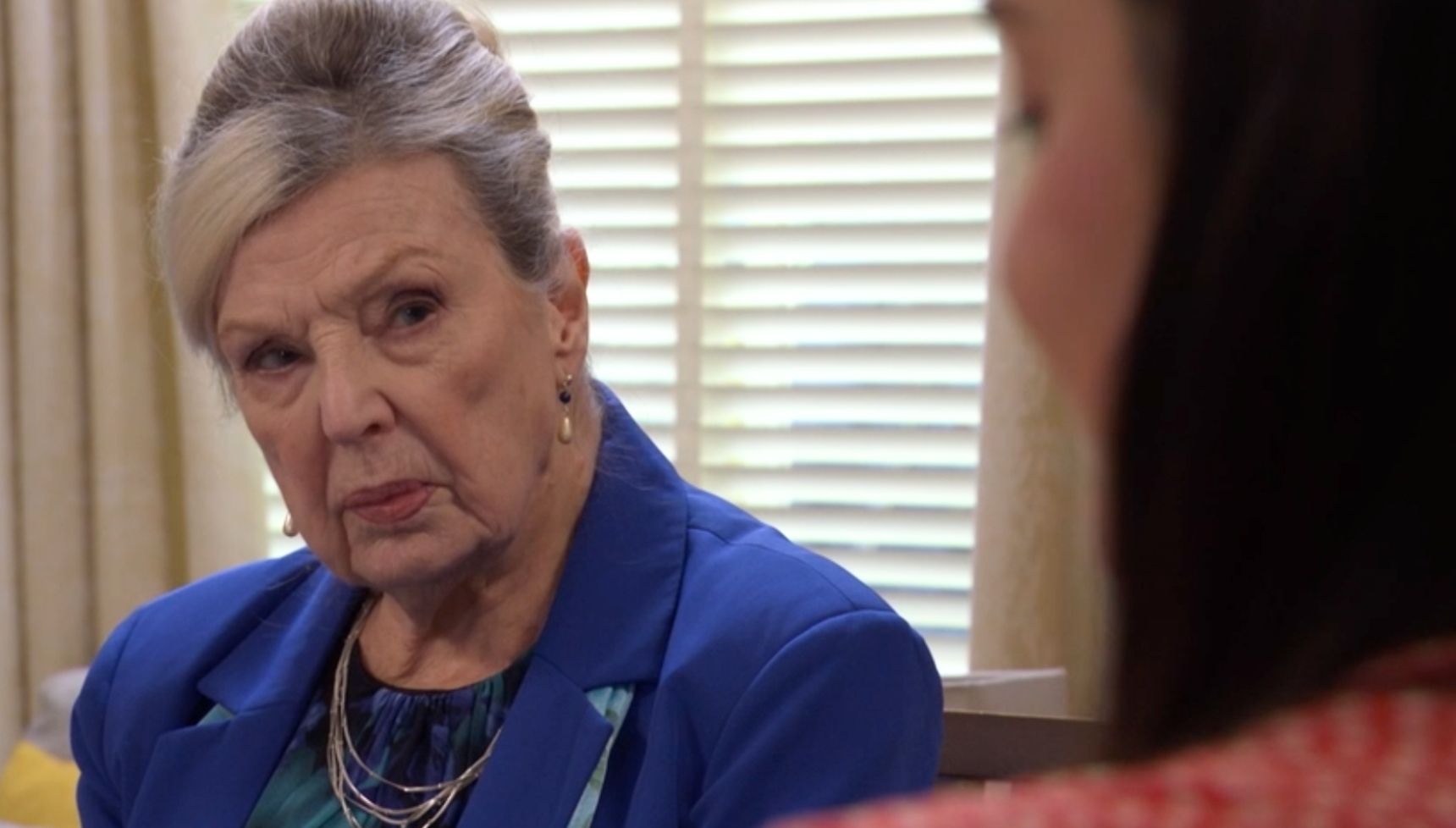 Cora looking at Lauren with a worried expression