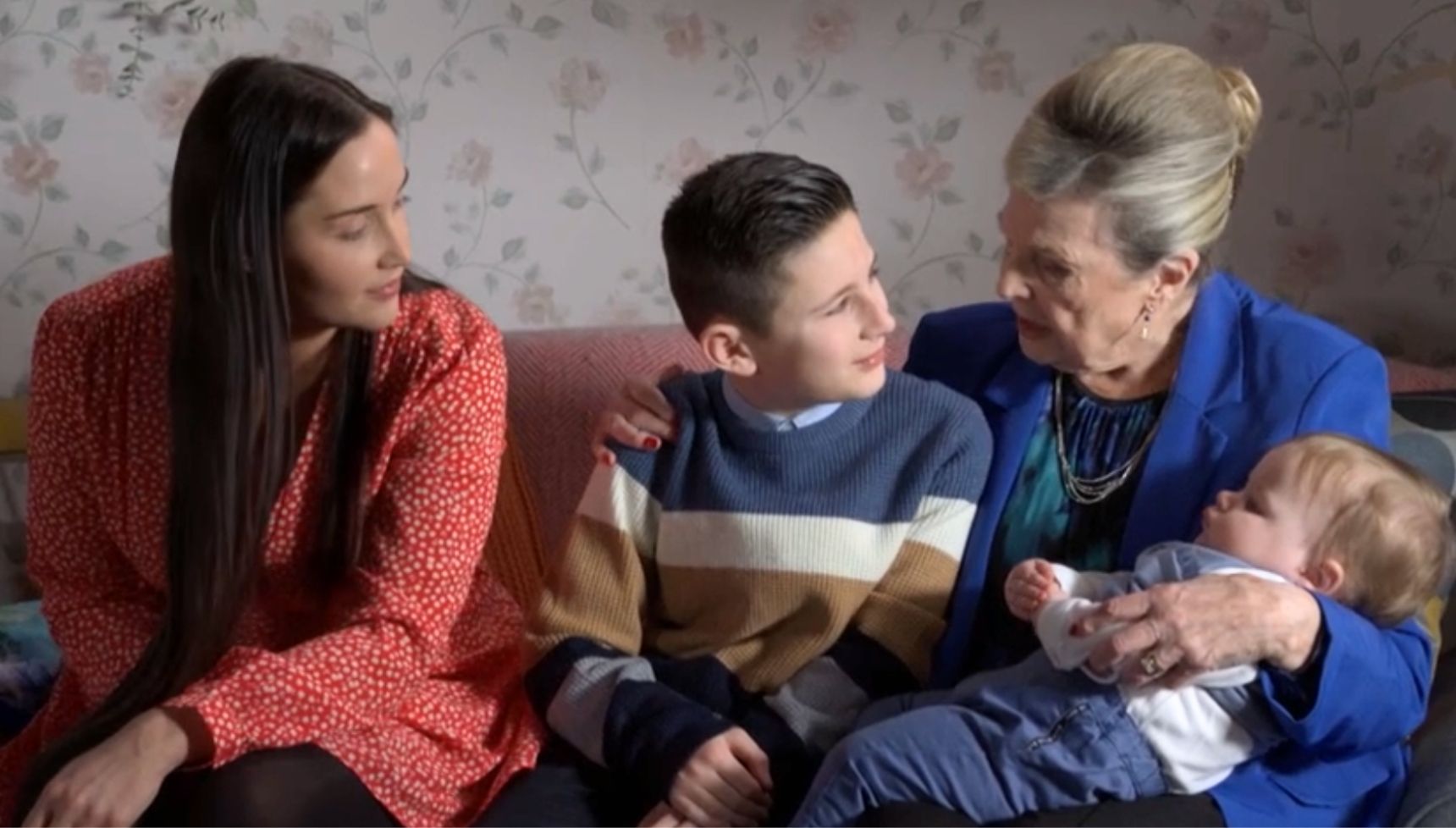 Cora hugging Louis and Jimmy with Lauren by her side