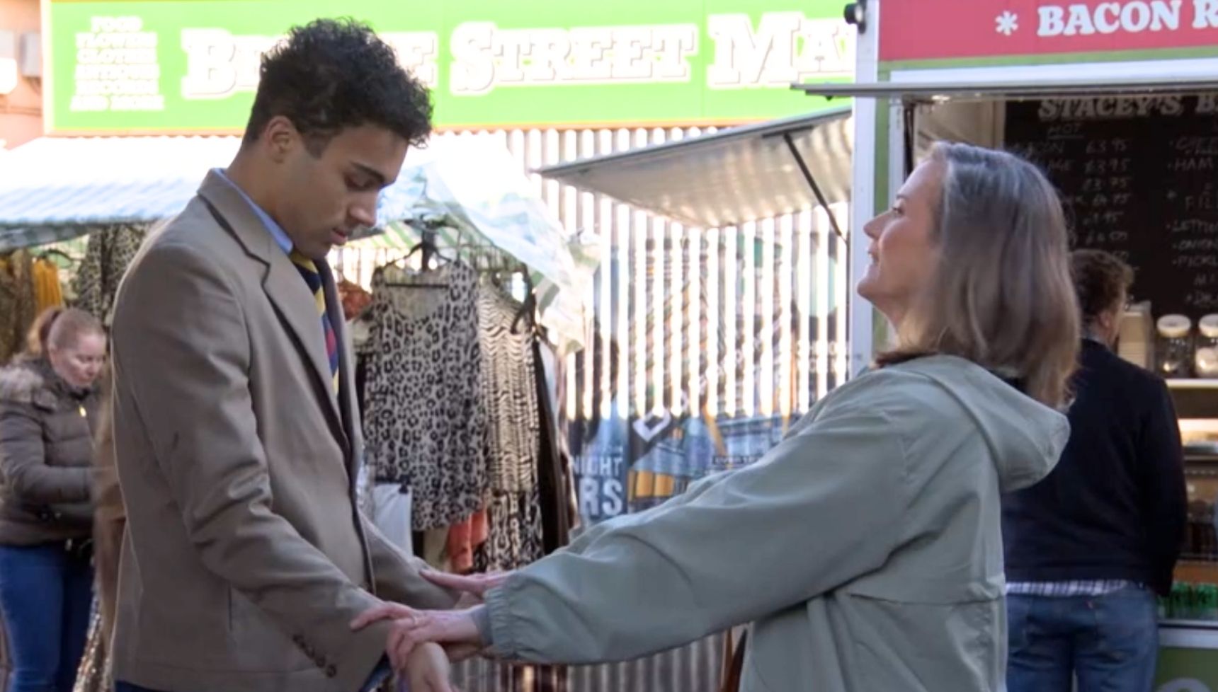 Sandra gives Josh a pep talk in the market before meeting Patrick