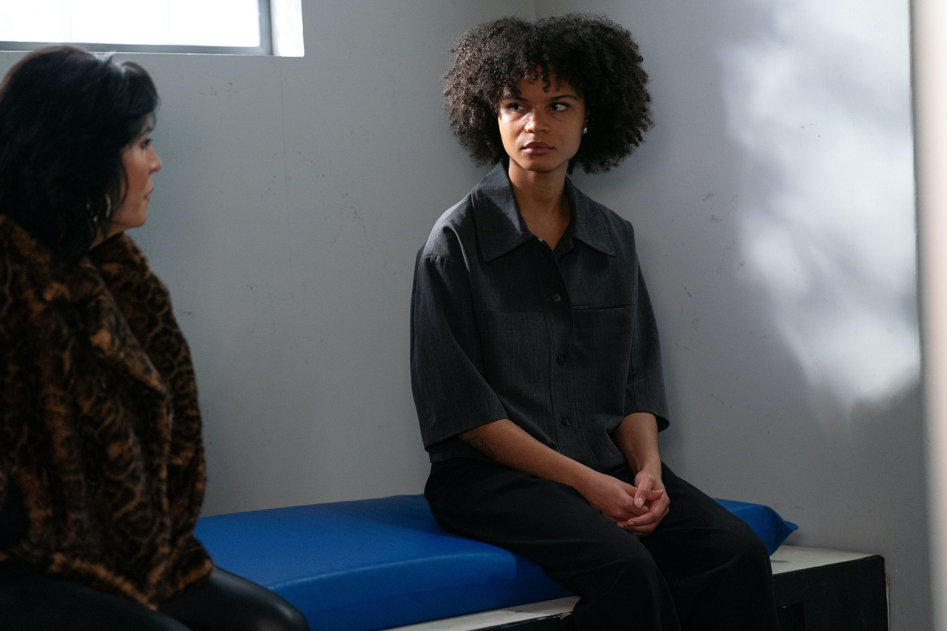 Kat and Jasmine talking in a prison cell