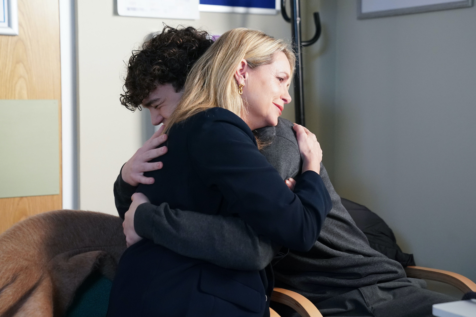 Sam and Ricky hugging 