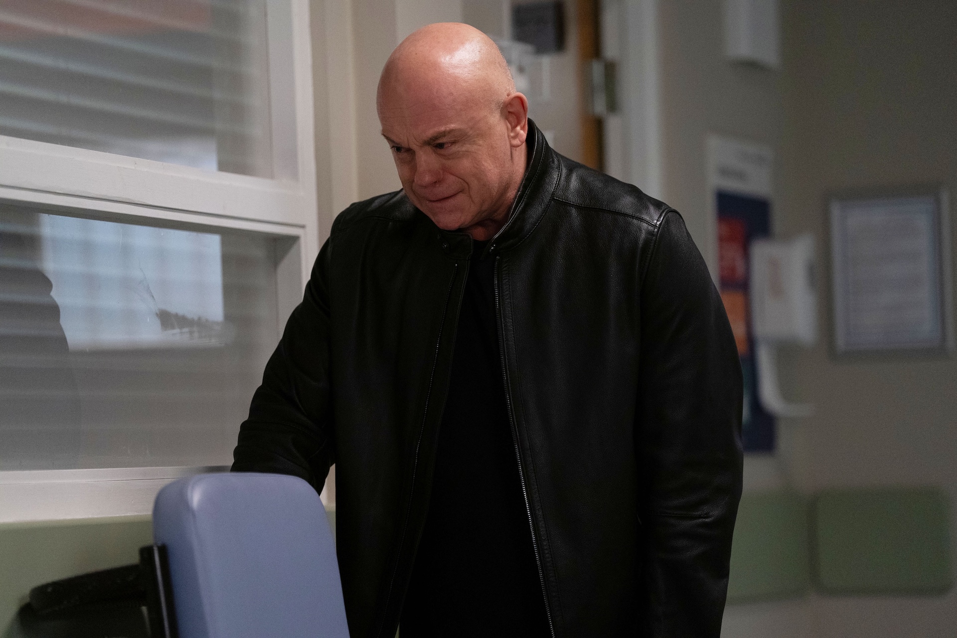 Grant crying in the hospital corridor 