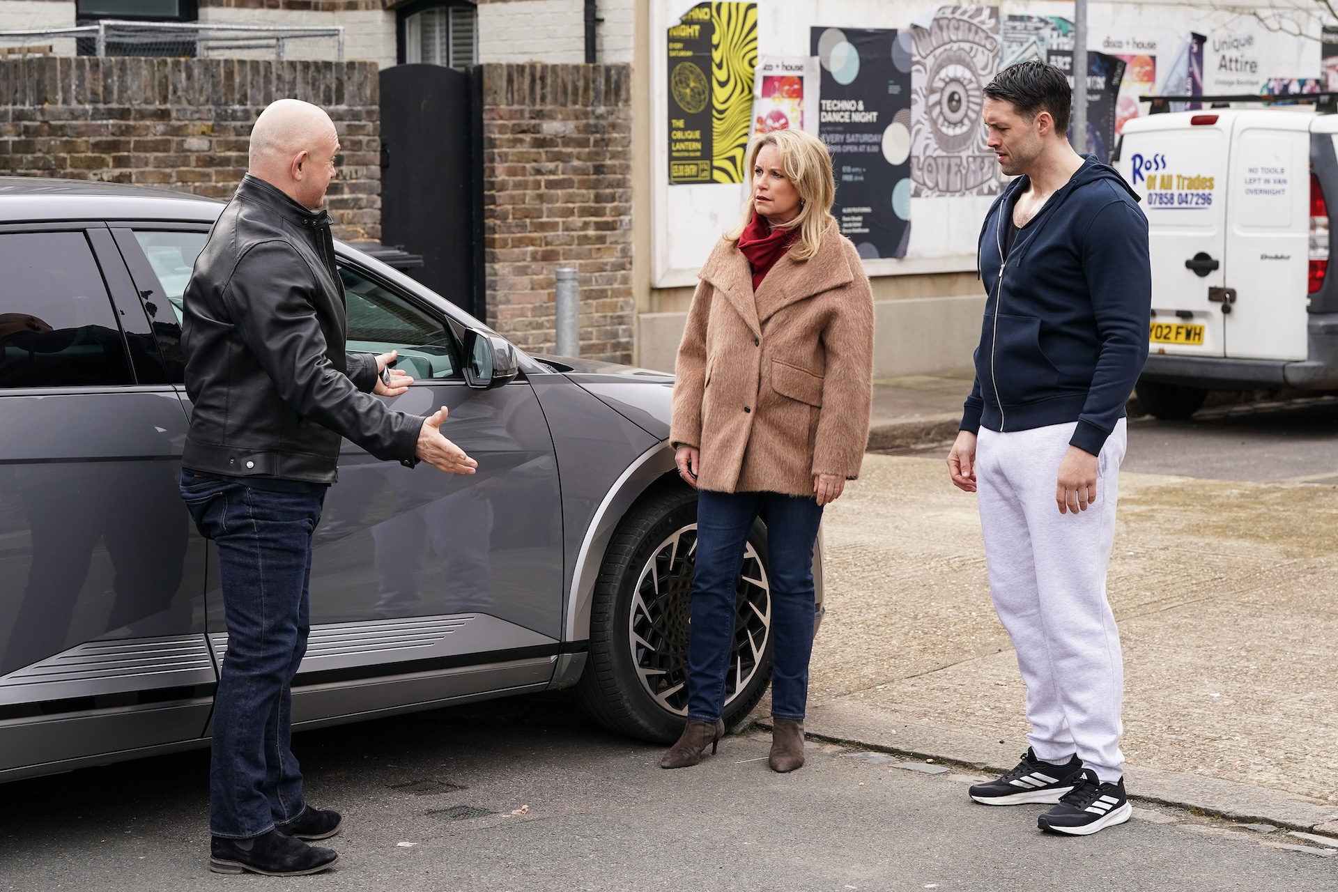 Grant arriving in Walford and a stunned Sam and Mark looking on
