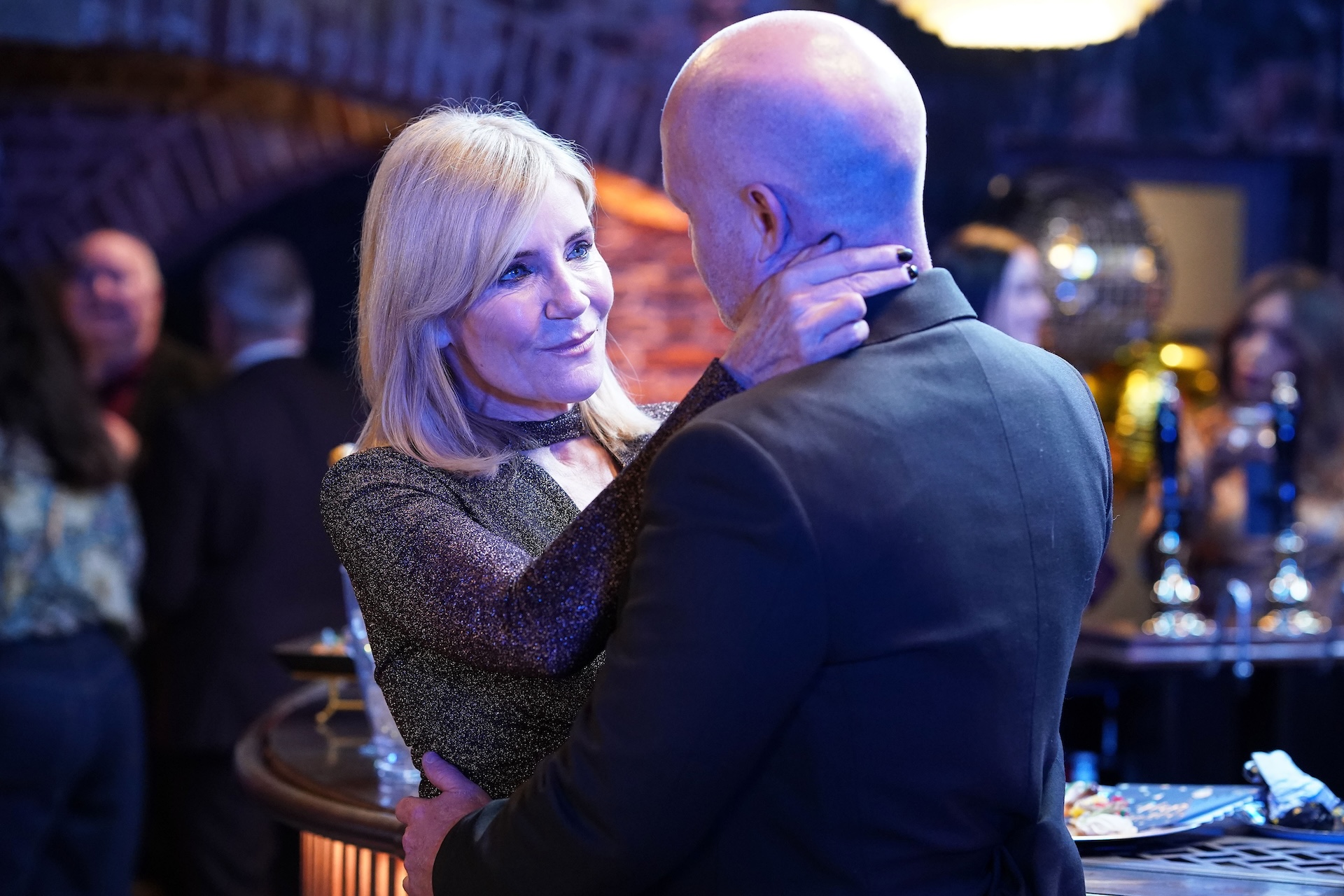 Max and Cindy in a bar looking into one another's eyes in EastEnders