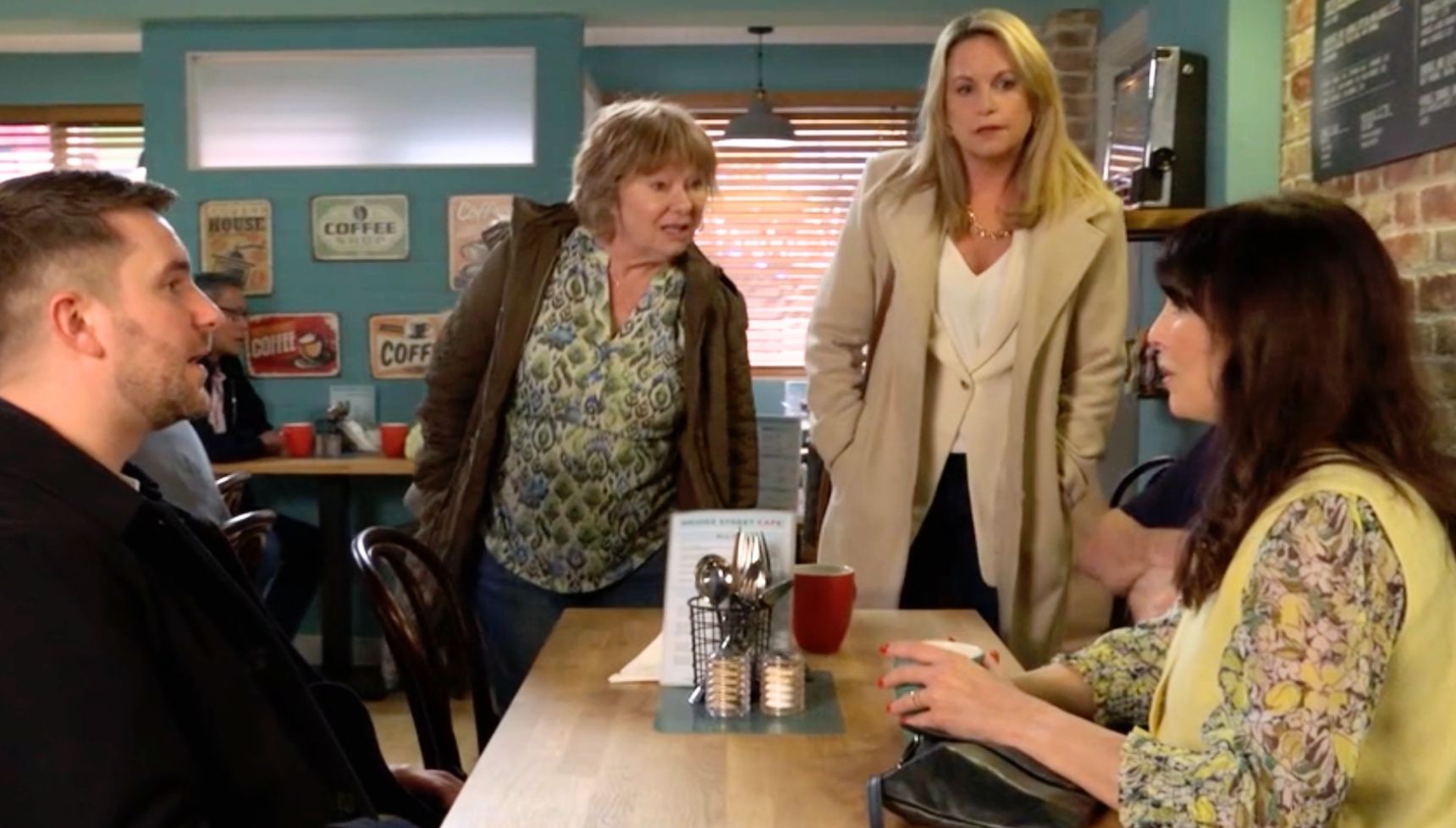 Honey, Julie, Callum and Sam talk in the cafe