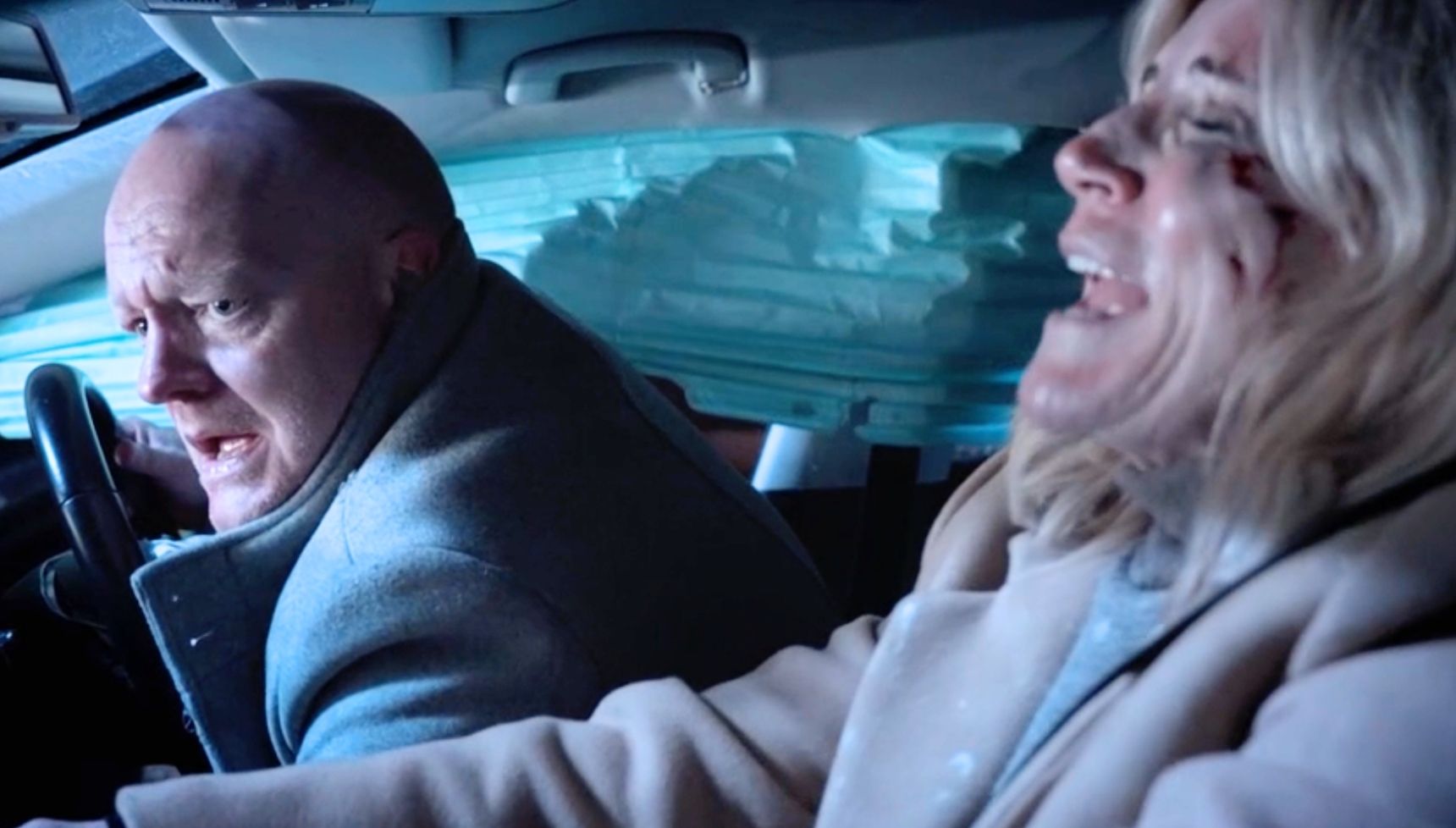 Max and Cindy trapped in the car wreckage 