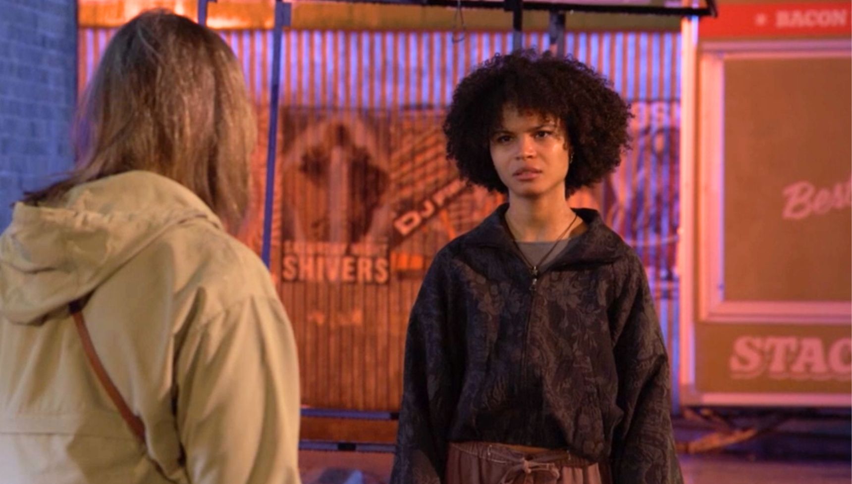 Jasmine and Sandra talk outside the pub