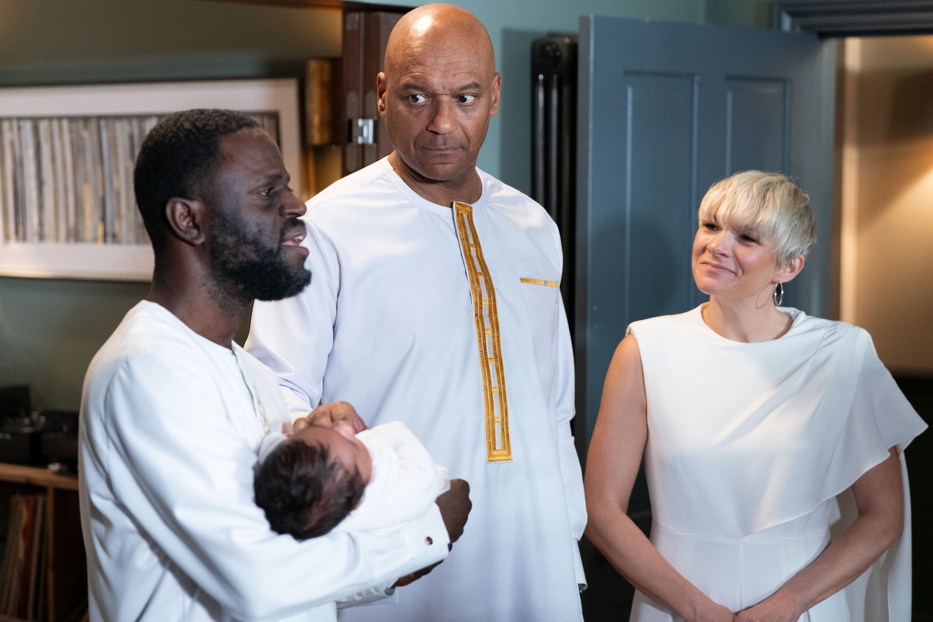 George, Kojo and Nicola at Ivy's naming day, all dressed in white 