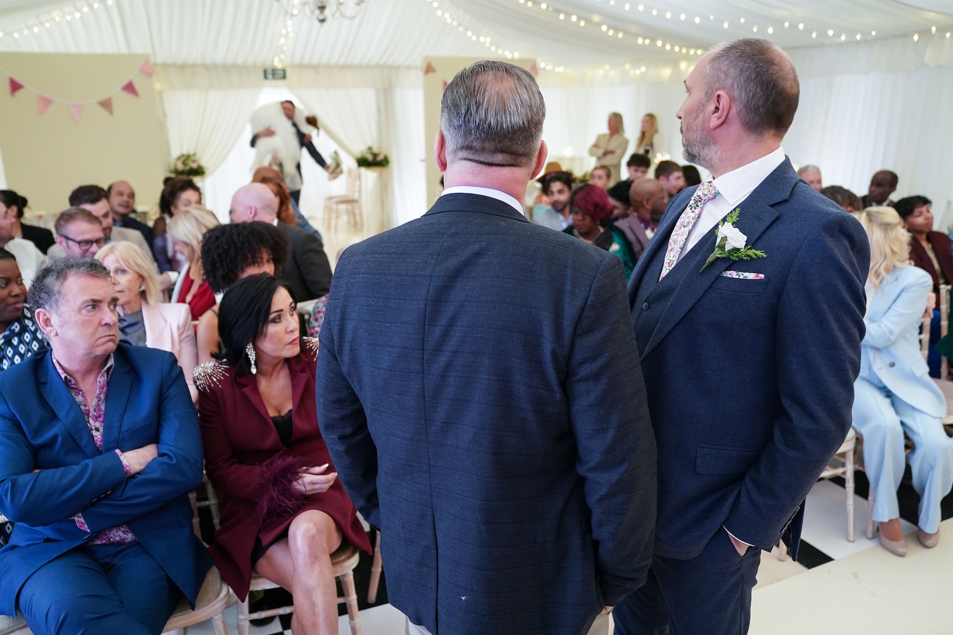 Ross looks on as Vicki arrives at the wedding venue 