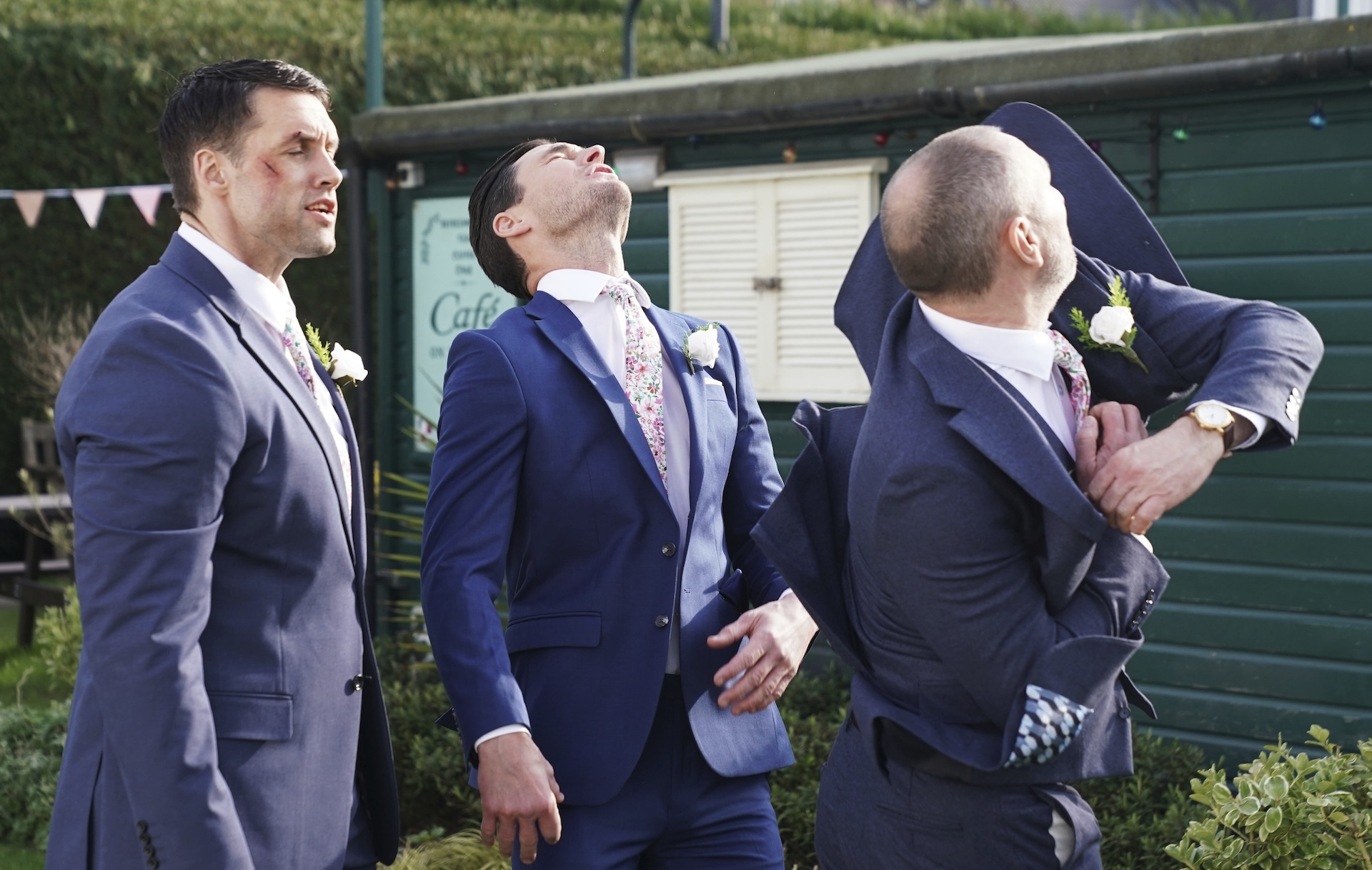 Zack gets a punch from Ross as Mark looks on