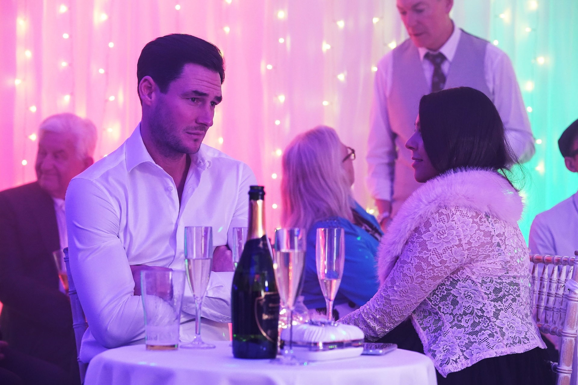 Priya and Zack talk at the wedding 
