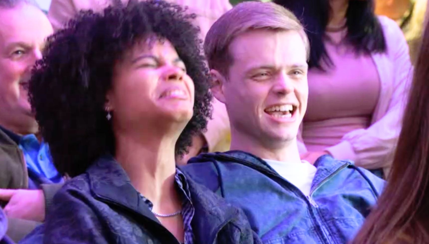 Oscar and Jasmine laughing at Ian on stage