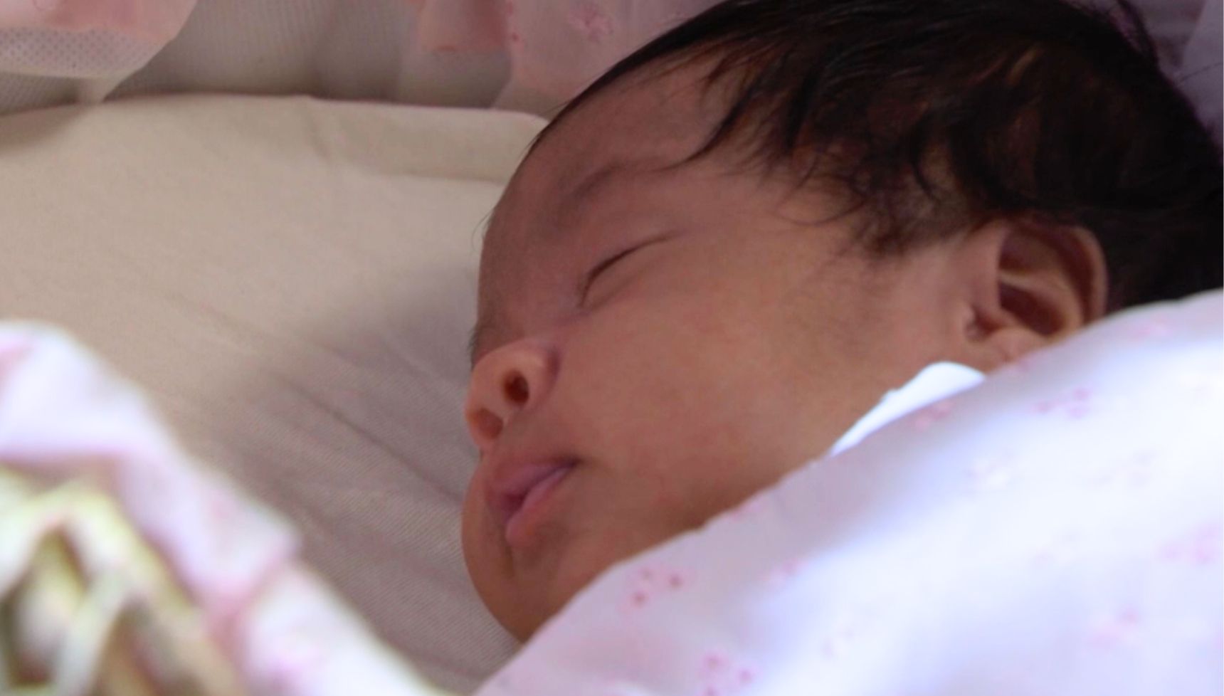 Baby Ivy asleep in a cot in EastEnders