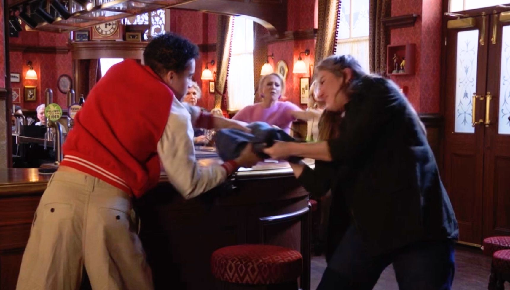 Josh wrestles a woman for his bag