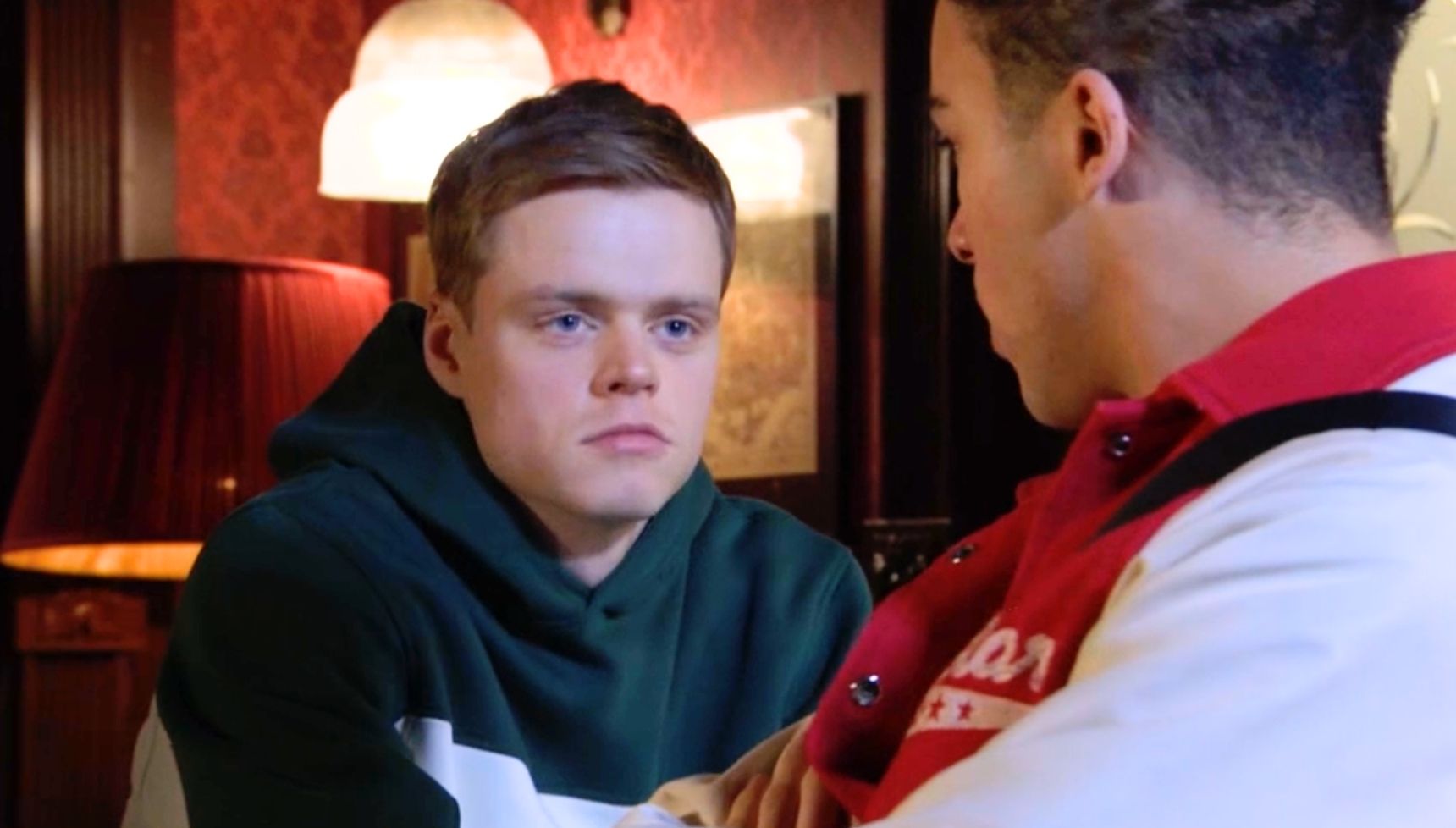 Josh and Oscar talking in the pub in EastEnders 