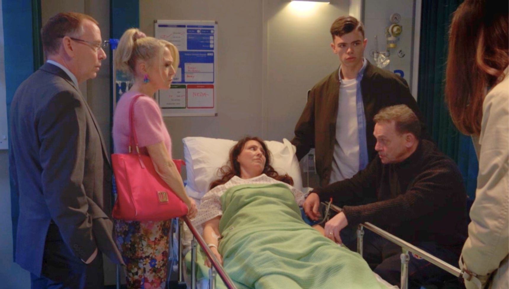 Ian, Linda, Will and Billy around Honey's hospital bed