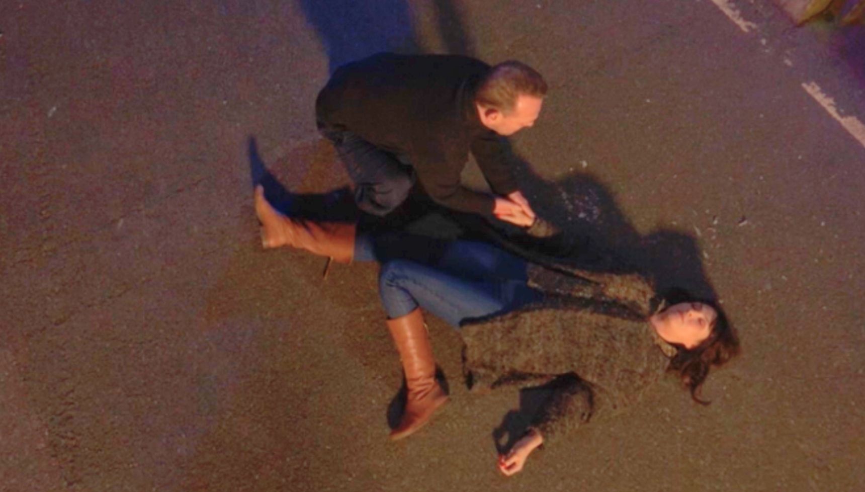 Honey lying on the floor as Billy tries to wake her 