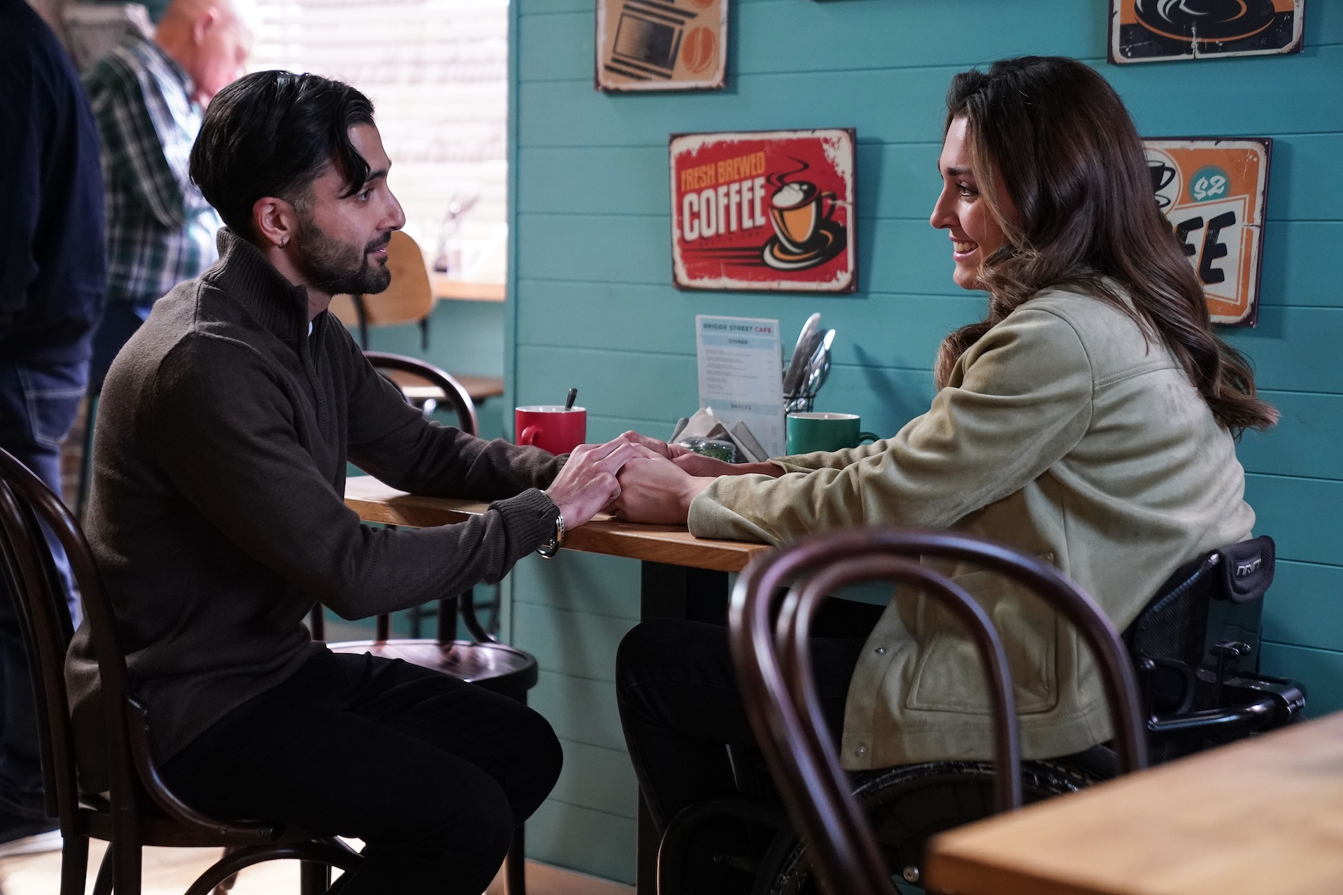 Vinny and Penny holding hands in the cafe in EastEnders spoilers 