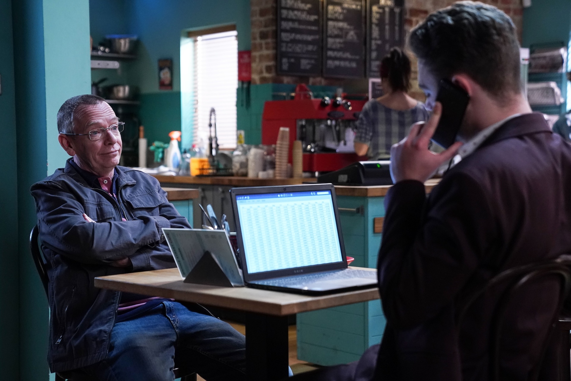 Ian looking annoyed while Johnny is on the phone 