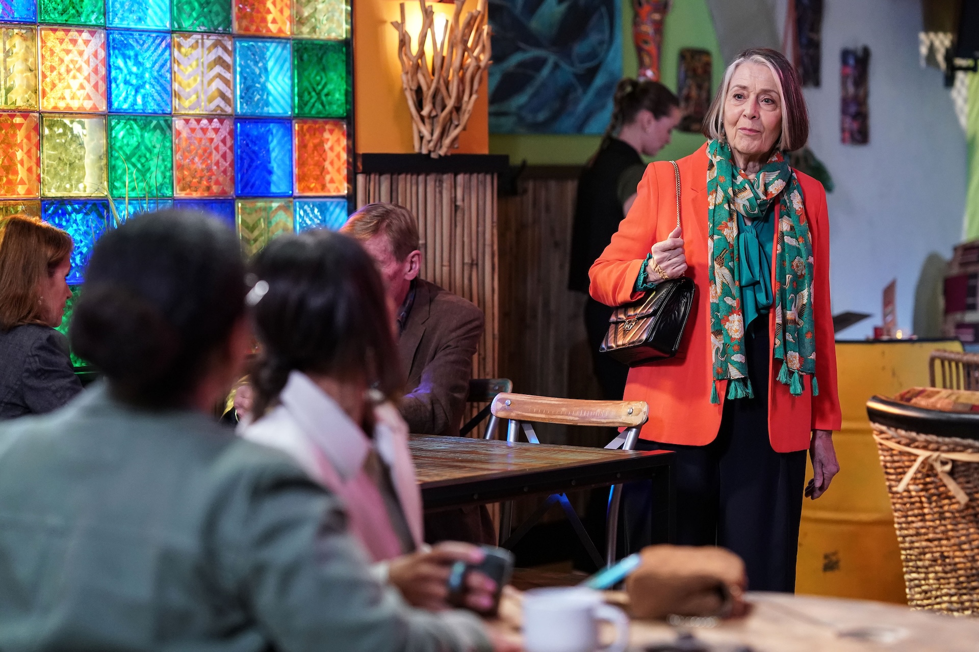 Sheila walking into the restaurant to meet Libby and Chelsea 