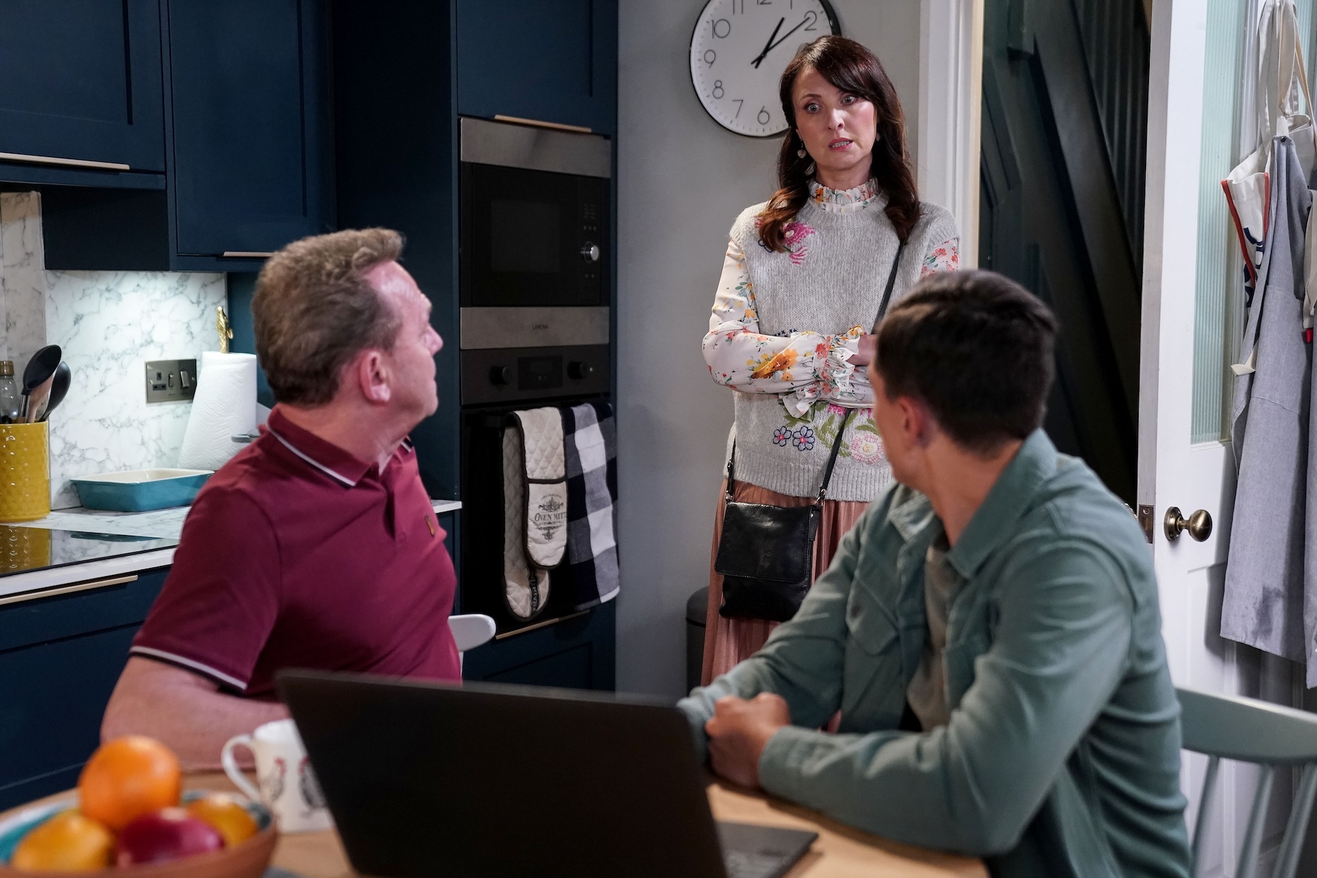 Billy and Will trying to show Honey something on the computer 