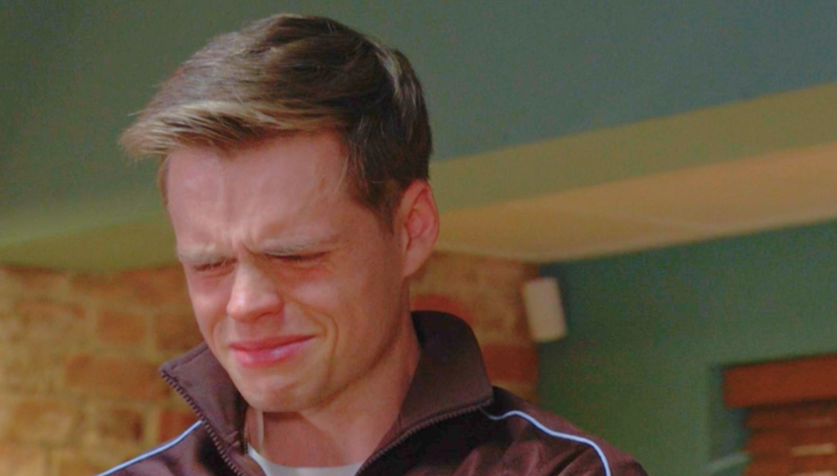 Oscar crying in the cafe after breaking up with Josh in EastEnders