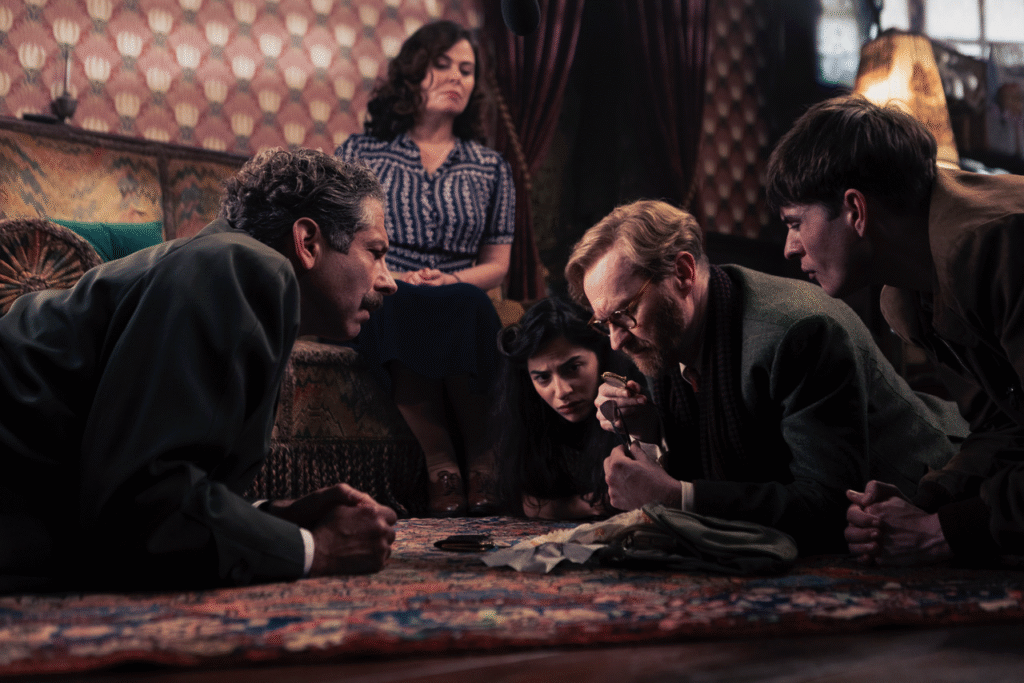 (L-R) Bookish cast members Elliot Levey as Inspector Bliss, Polly Walker as Trottie, Buket Kömür as Nora, Mark Gatiss as Gabriel Book and Connor Finch as Jack. [Credit: U&Alibi/UKTV]
