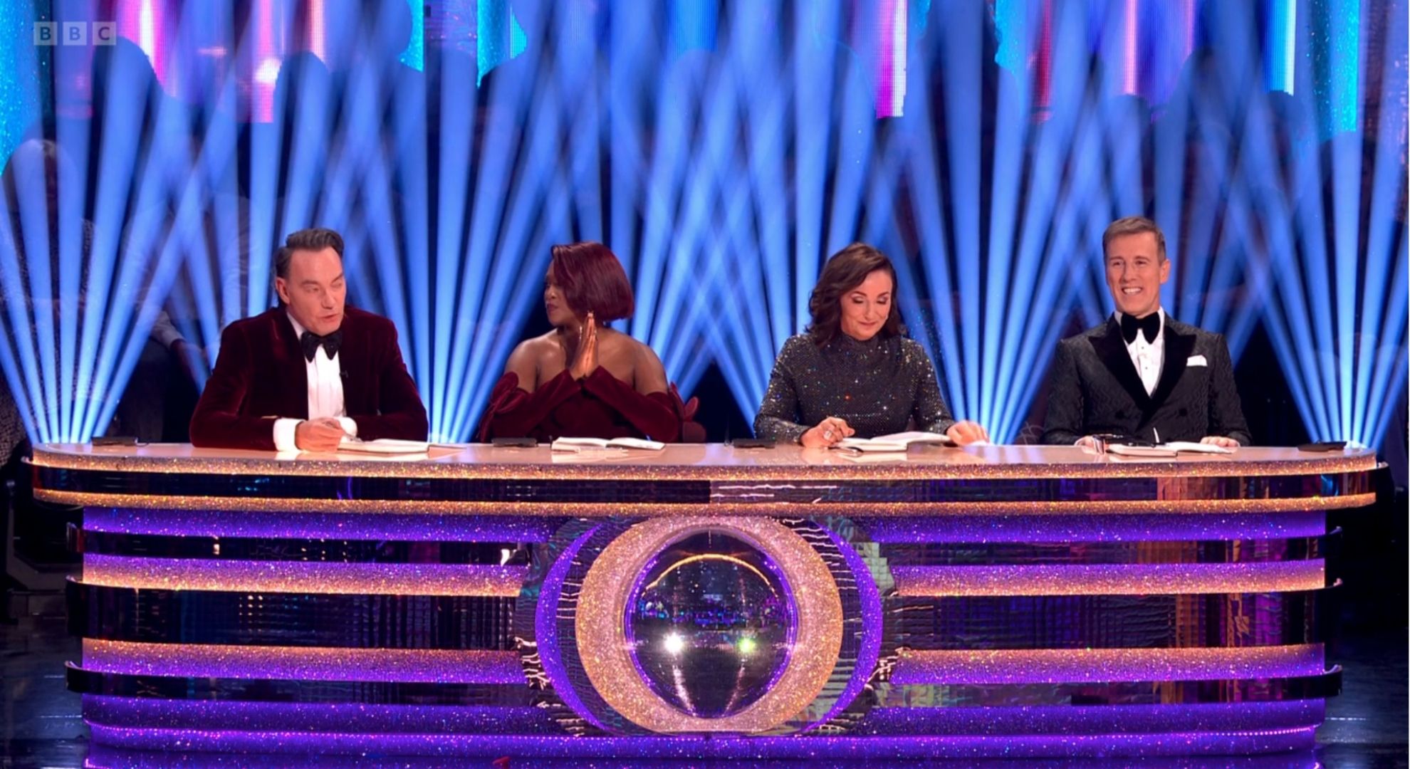 The Strictly Come Dancing judges sitting at the table