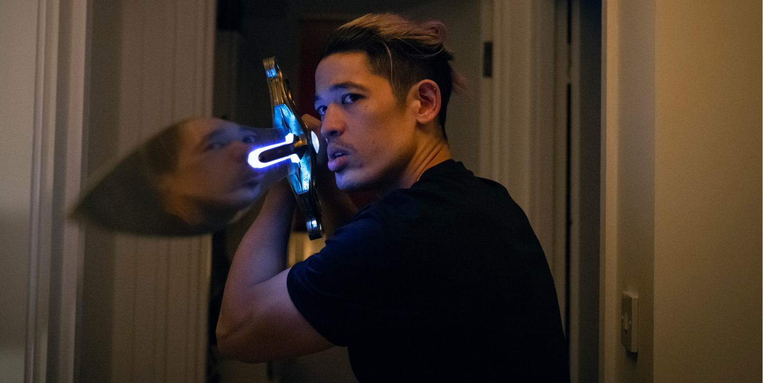 A close up of Roddy Ho with a light-up sword in Slow Horses season 5.