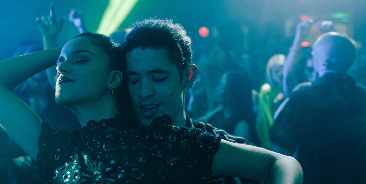 Hiba Bennani and Christopher Chung dancing together in Slow Horses season 5.